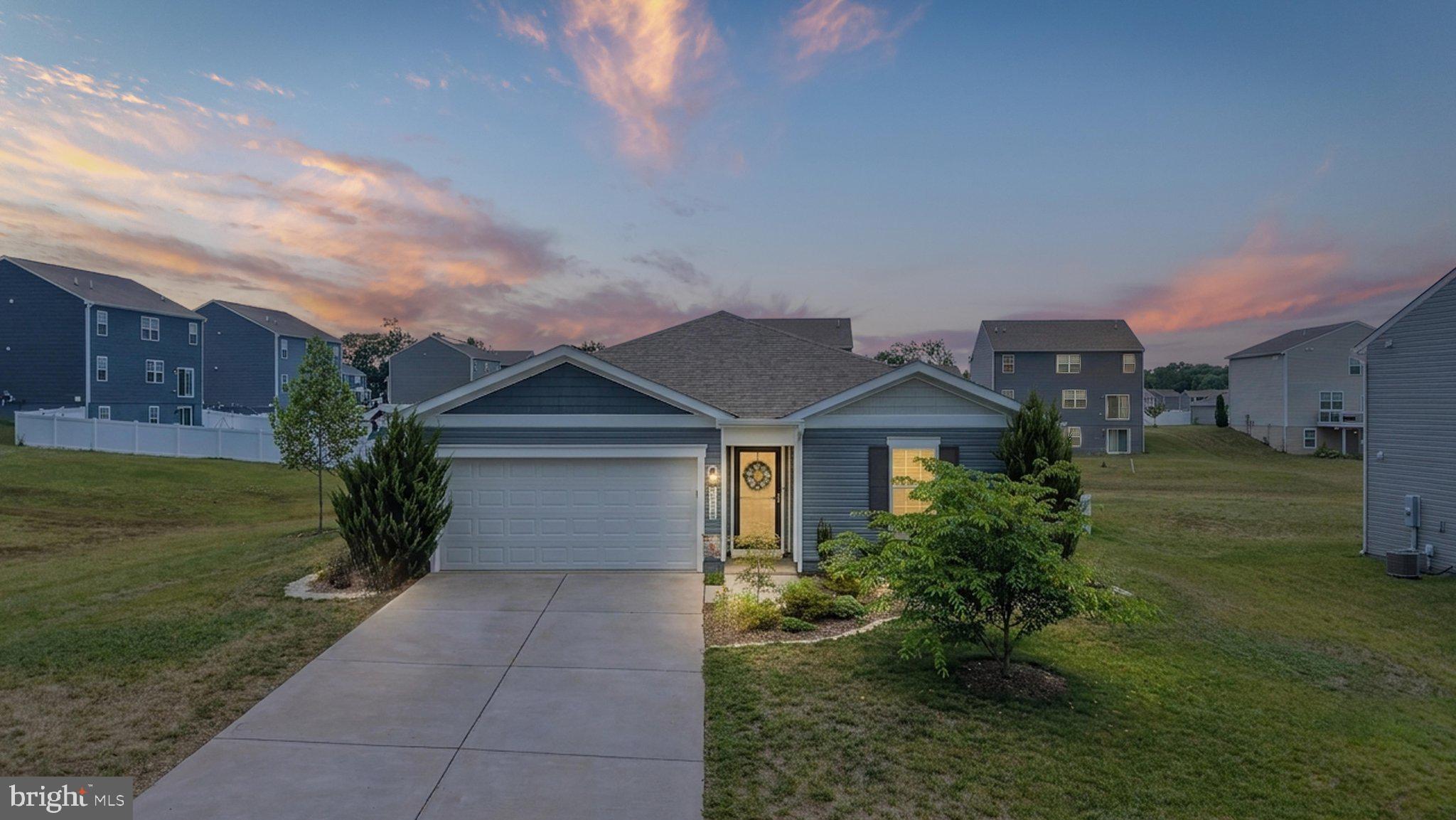 Welcome to 513 Weeks Court in Shenandoah Crossing! This like-new, one-level home offers 4 bedrooms, 2 full baths, and approximately 1,500 square feet of thoughtfully upgraded living space on an oversized 0.29-acre lot (77' x 164').
From the moment you arrive, you'll appreciate the mature landscaping, inviting curb appeal, and numerous improvements that make this home truly move-in ready. Inside, you'll find fresh neutral paint, updated lighting, ceiling fans throughout, 2-inch blinds, and storm/screen doors that enhance both comfort and functionality.
The open-concept kitchen has been upgraded with a stylish tile backsplash, built-in coffee and wine bar, and an under-sink water filtration system—perfect for everyday living and entertaining. The spacious primary suite features an ensuite bath with an upgraded illuminated cabinet and shower water filtration system. Three additional bedrooms provide flexibility for guests, a home office, or hobbies.
The laundry room has been enhanced with additional shelving and a built-in ironing board cabinet with storage, while the attached two-car garage includes overhead storage racks for exceptional organization.
Step outside and discover an outdoor oasis designed for relaxing and entertaining. The fully fenced backyard features a 12' x 14' covered porch complete with a ceiling fan and covered grilling station, an expansive stone patio with an outdoor sink and planting bench, an 8' x 8' storage shed, fire pit, mature shade trees, flowering shrubs, and beautiful perennial gardens.
Located in the desirable Shenandoah Crossing community, this home offers easy access to downtown Berryville, Winchester, commuter routes, shopping, dining, wineries, and outdoor recreation.
With all of the upgrades already completed, this home is truly move-in ready—just unpack and start enjoying everything it has to offer!