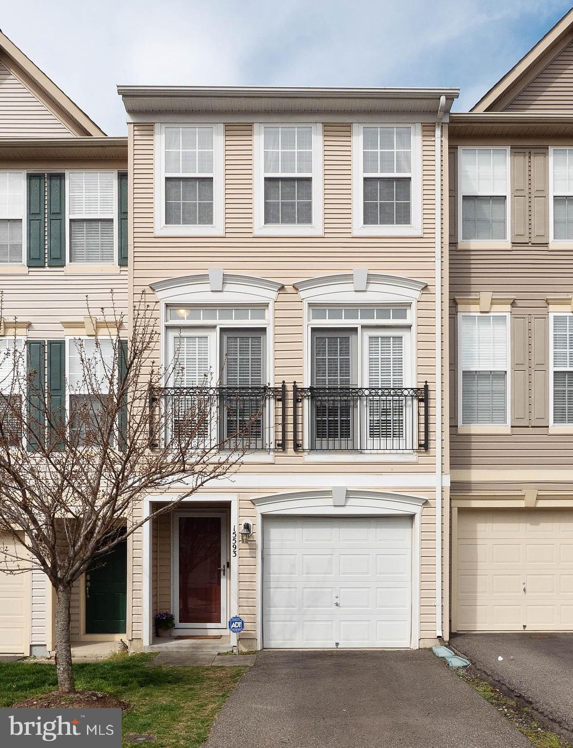 Welcome Spring in style in this amazing former model home that's in immaculate condition!  You'll enjoy a lifestyle of ultimate convenience to I-95, VRE, Stonebridge at Potomac Town Center, shopping, dining and recreation. This Powells Run Village community home offers 3 beautifully finished levels with the sought-after interior and exterior features for your enjoyment.  Start with a welcoming ceramic-tiled entry with easy access to the ground level bedroom that has a private bath and access to the rear yard space.  The sunny main level is an open layout filled with gleaming hardwood floors; elegant dining and living rooms; half bath; and a stunning eat-in kitchen design with granite counters, portable center island, GE stainless steel appliances, and walk-out to a sizable deck perfect for summertime grilling and entertaining.  Retreat to the upper level with a spacious master suite with a private full bath, and another sizable bedroom with a private full bath.  All lawn care and trash service included in HOA.  Additional pleasures: Spectacular community views; Ecobee thermostat; Nest doorbell; shelving in garage; alarm system; guest parking in the neighborhood; and community pool, clubhouse, gym and tot lot.  More to see and experience.  You'll be proud to call this "Home".