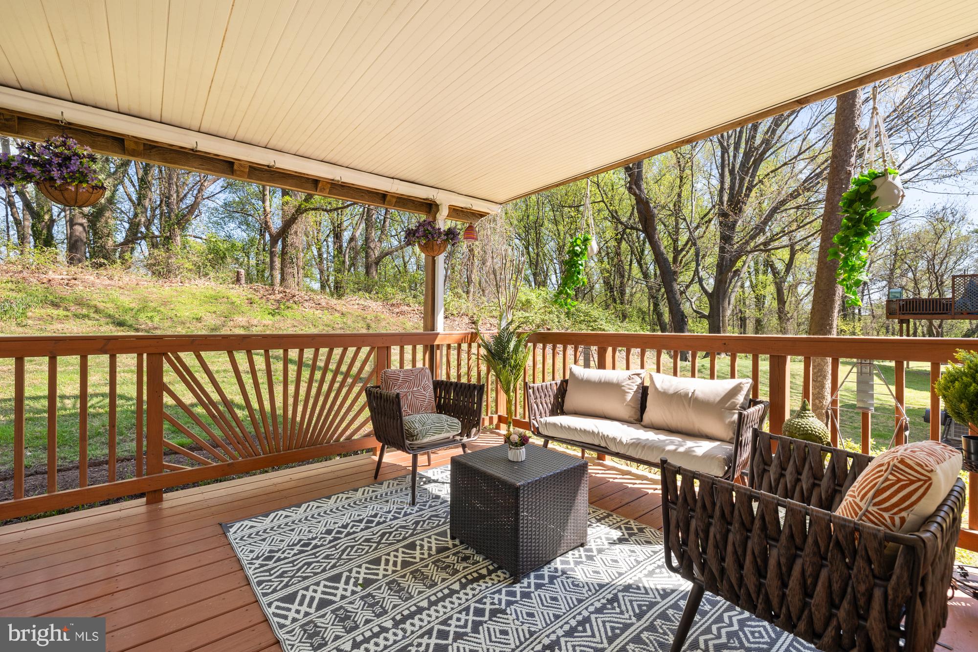 Offer deadline is 3 PM on Tuesday, April 15th.  Thank you.

Tucked into the peaceful Sumner Clusters community and backing to the serene Little Falls Stream Valley Park and the Capital Crescent Trail, this rare one-level condo offers a private, nature-filled retreat with unbeatable access to Downtown Bethesda and DC.

Inside, you're welcomed by a bright, inviting family room with a cozy wood-burning fireplace—perfect for chilly evenings. The open-concept layout flows effortlessly from the living area to the dining room and kitchen, creating an ideal space for everyday living and entertaining. The kitchen is a true standout, featuring stainless steel appliances, granite countertops, soft-close drawers, a pantry, and plenty of storage to handle all your culinary adventures.

All on one level, the home features three spacious bedrooms, one full bath, a convenient half bath, and in-unit laundry—all designed for comfortable, easy living. Closet space is generous throughout.

Love the outdoors? Step out to your private, covered deck—perfect for morning coffee or evening wind-downs—with a paved patio just below for grilling or gathering.

With recent updates including a new water heater (2020), a new roof with 30-year warranty (2020), and a renovated kitchen (2018), this home is move-in ready. Plus, there's plenty of parking and an EV charger installation is an option.