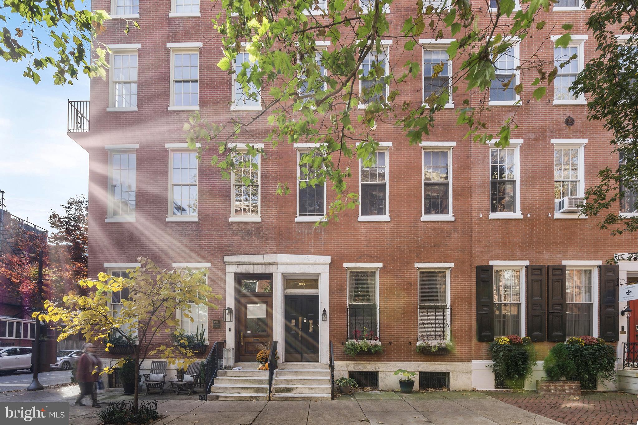Welcome to this charming, light-filled bi-level condominium nestled in the heart of Philadelphia’s highly desirable Rittenhouse Square neighborhood. Set within a historic building rich in character, this inviting residence features original wide-plank pine hardwood floors, elegant crown molding, soaring 10-foot ceilings, and a beautiful fireplace mantel that serves as a timeless focal point.

The open-concept main level offers a bright and airy living space, seamlessly connecting the spacious living room to an updated kitchen appointed with granite countertops, stainless steel appliances, and ample cabinetry—perfect for both everyday living and entertaining.

Upstairs, the generously sized bedroom provides plenty of flexibility for a sitting area, home office, or reading nook. A newly renovated closet offers exceptional storage, while the marble and tile bathroom is enhanced by a skylight that fills the space with natural light.

Additional amenities include individual laundry and dedicated storage space in the basement, along with access to a shared brick patio—an ideal urban retreat for relaxing outdoors.

Condo fees include heat, hot water, water, sewer, and cooking gas, with owners responsible only for electric service. Just steps from the renowned dining, shopping, parks, and cultural attractions that define Rittenhouse Square, this move-in-ready home offers an exceptional opportunity to enjoy sophisticated city living in one of Philadelphia’s most sought-after neighborhoods.