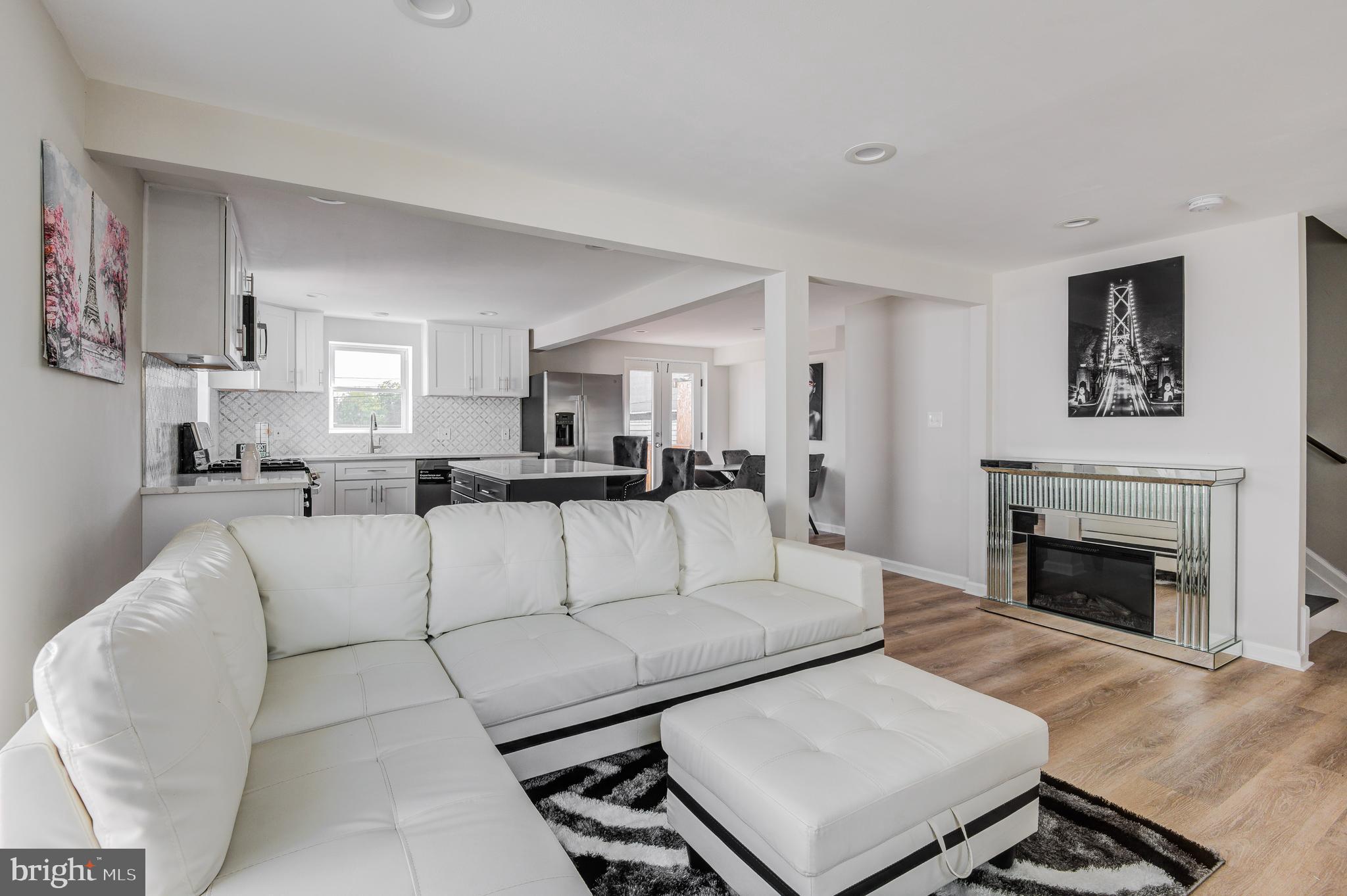 May qualify  for up to $10,000 Vacant to Value Grant ! Get ready to fall in love with this beautifully renovated 3bd/2ba rowhome in the Reisterstown Station neighborhood. This house is like a fresh start because everything is brand new, inside and out giving you absolute peace of mind and making the home a comfy and hassle free place to live. The kitchen is spacious boasting a large island and beautiful countertops. Upstairs there are two large bedrooms that share a custom bathroom and a laundry room that adds an extra layer of convenience. The finished basement provides additional living space perfect for entertaining along with the full bathroom and bedroom. The bathrooms have cool custom tiles. Outside there are two great features as well - a large deck where you can relax and off street parking. Schedule a tour today so that you can pack your bags and move right on in!