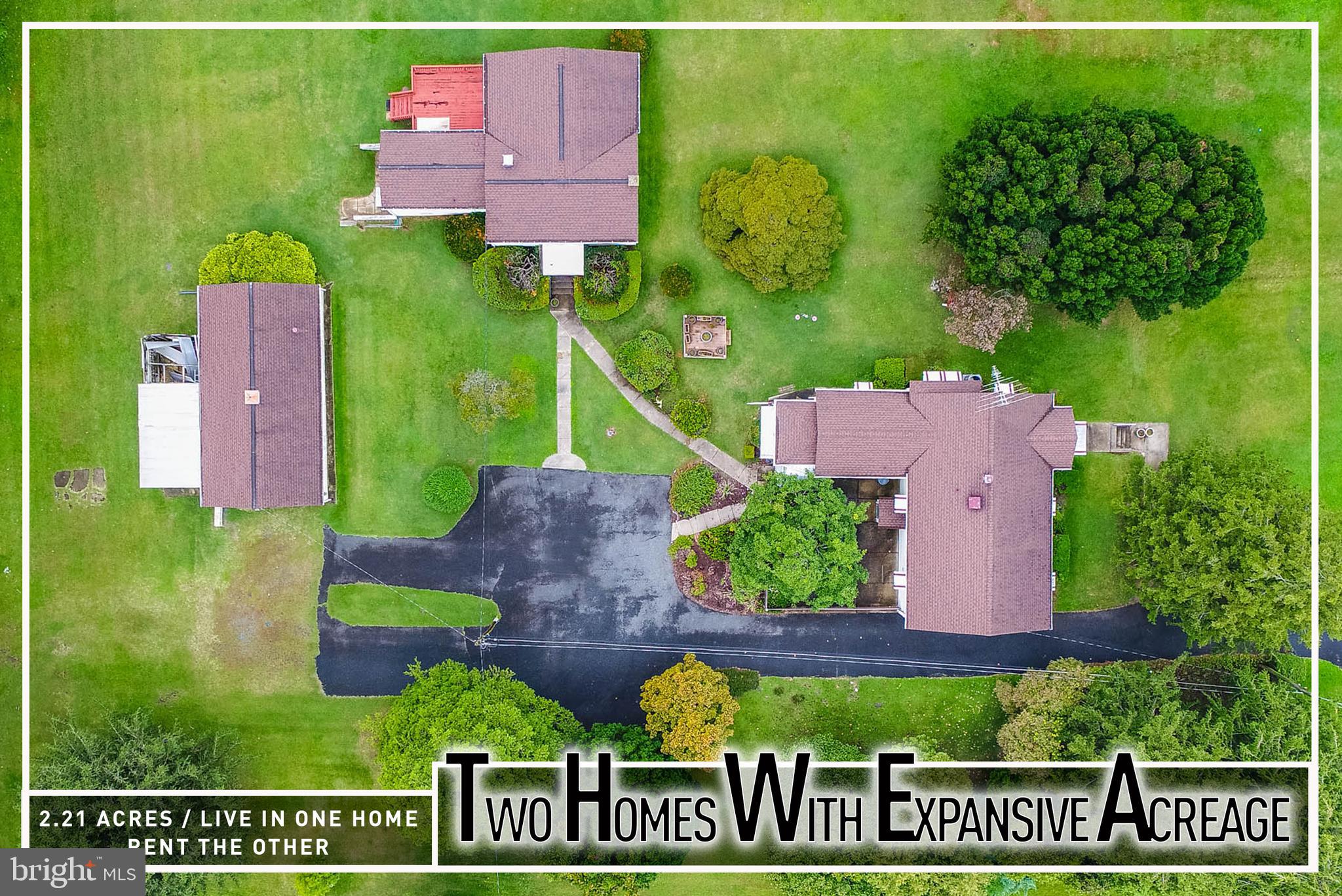 Unique multi-home property on over 2 acres! Rare opportunity to own an expansive parcel featuring two separate houses across three tax IDs. The main house offers a spacious living room, kitchen, 3 bedrooms, 2 full baths including one in the finished lower level with a family room, plus an enclosed porch and rear patio for outdoor living. The second home provides its own private space with a living room, kitchen, 2 bedrooms, 1 full bath, and a rear deck. Additional highlights include a detached garage, abundant parking, and sprawling grounds with endless possibilities. Conveniently located close to shopping, dining, and major roadways. An ideal setup to live in one home and rent the other for added income!  Sold As-Is - Buyer to Verify Zoning