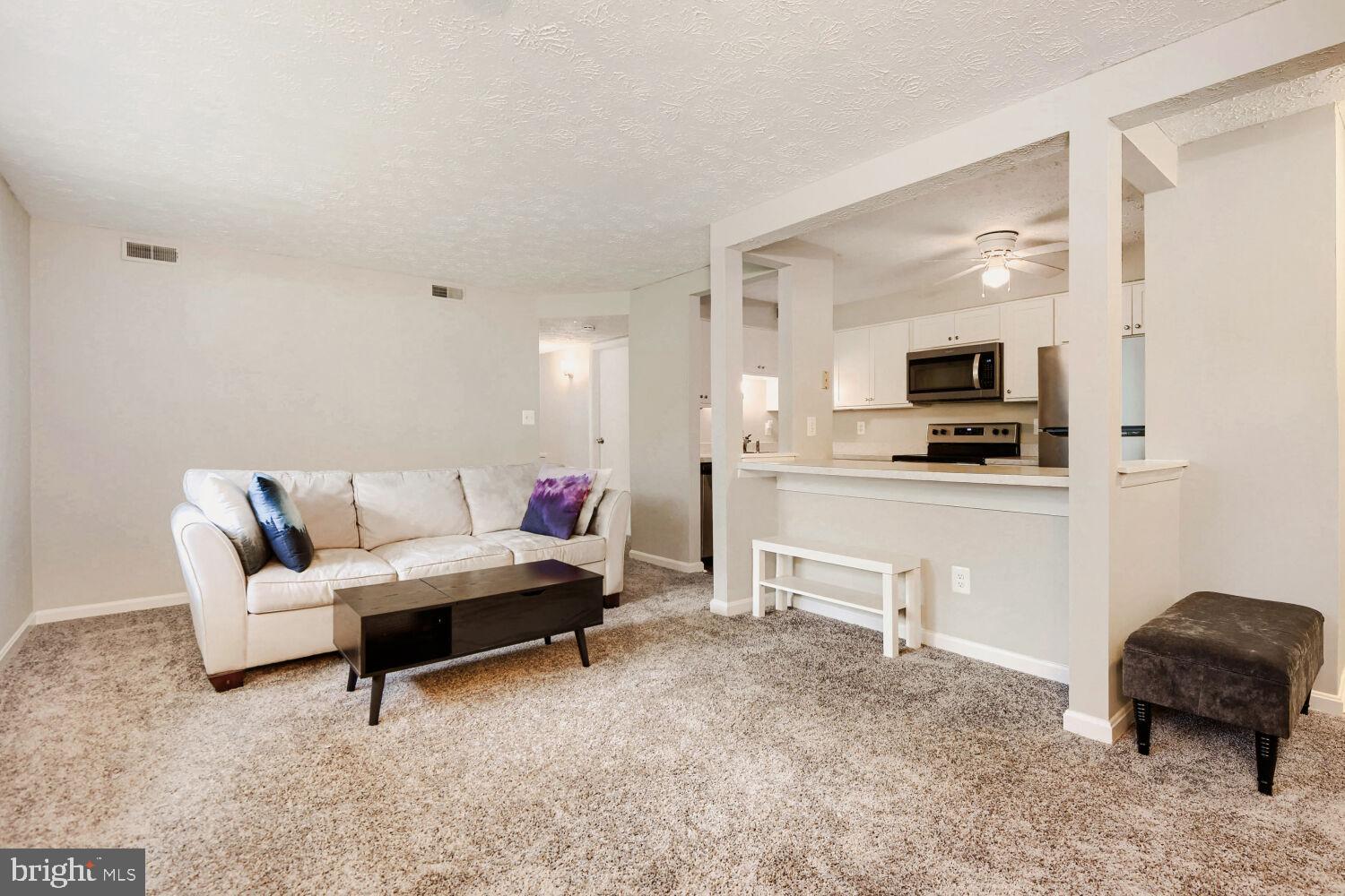 Welcome to this beautifully updated ground-floor condo in the highly sought-after Chesterfield community! Offering 2 spacious bedrooms and 1 full bath, this move-in ready home combines comfort, convenience, and value in a desirable location.

Step inside to find brand-new carpet throughout the living areas and bedrooms, complemented by luxury plank vinyl flooring in the foyer, kitchen, and bathroom. The bright, open floor plan is designed for easy everyday living. The updated kitchen features modern finishes, stainless steel appliances, pantry, and a dedicated breakfast area perfect for morning coffee, casual dining, or entertaining guests. The renovated bathroom adds a fresh, contemporary touch, while the LG ventless washer/dryer combo provides added convenience right inside the home.

The spacious primary bedroom features a large walk-in closet, and both bedrooms offer ample storage and natural light. One of this home's standout features is its peaceful setting backing to open community green space, providing a relaxing, park-like backdrop and added privacy rarely found in condo living. Enjoy the ease of ground-floor access with convenient nearby parking and beautifully maintained surroundings.

Residents of Chesterfield enjoy a wide array of community amenities, including swimming pools, basketball and tennis courts, playgrounds, walking paths, and expansive common areas. Conveniently located near shopping, dining, schools, and major commuter routes, this home offers easy access to Baltimore, Annapolis, Fort Meade/NSA, and Washington, D.C.

Whether you're a first-time homebuyer, downsizing, or seeking a low-maintenance lifestyle, this updated condo is ready to welcome you home.