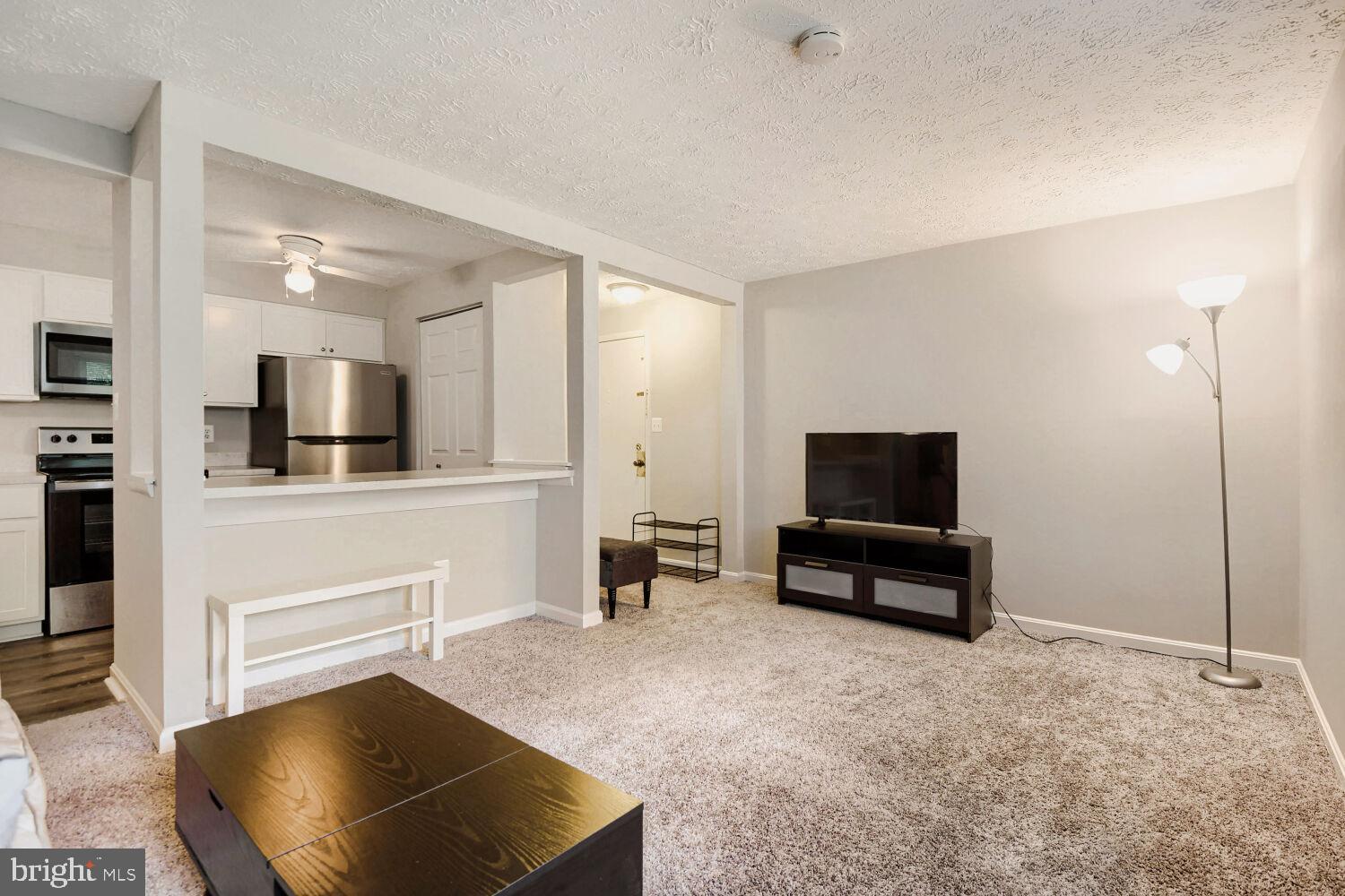 Welcome to this beautifully updated ground-floor condo in the highly sought-after Chesterfield community! Offering 2 spacious bedrooms and 1 full bath, this move-in ready home combines comfort, convenience, and value in a desirable location.

Step inside to find brand-new carpet throughout the living areas and bedrooms, complemented by luxury plank vinyl flooring in the foyer, kitchen, and bathroom. The bright, open floor plan is designed for easy everyday living. The updated kitchen features modern finishes, stainless steel appliances, pantry, and a dedicated breakfast area perfect for morning coffee, casual dining, or entertaining guests. The renovated bathroom adds a fresh, contemporary touch, while the LG ventless washer/dryer combo provides added convenience right inside the home.

The spacious primary bedroom features a large walk-in closet, and both bedrooms offer ample storage and natural light. One of this home's standout features is its peaceful setting backing to open community green space, providing a relaxing, park-like backdrop and added privacy rarely found in condo living. Enjoy the ease of ground-floor access with convenient nearby parking and beautifully maintained surroundings.

Residents of Chesterfield enjoy a wide array of community amenities, including swimming pools, basketball and tennis courts, playgrounds, walking paths, and expansive common areas. Conveniently located near shopping, dining, schools, and major commuter routes, this home offers easy access to Baltimore, Annapolis, Fort Meade/NSA, and Washington, D.C.

Whether you're a first-time homebuyer, downsizing, or seeking a low-maintenance lifestyle, this updated condo is ready to welcome you home.