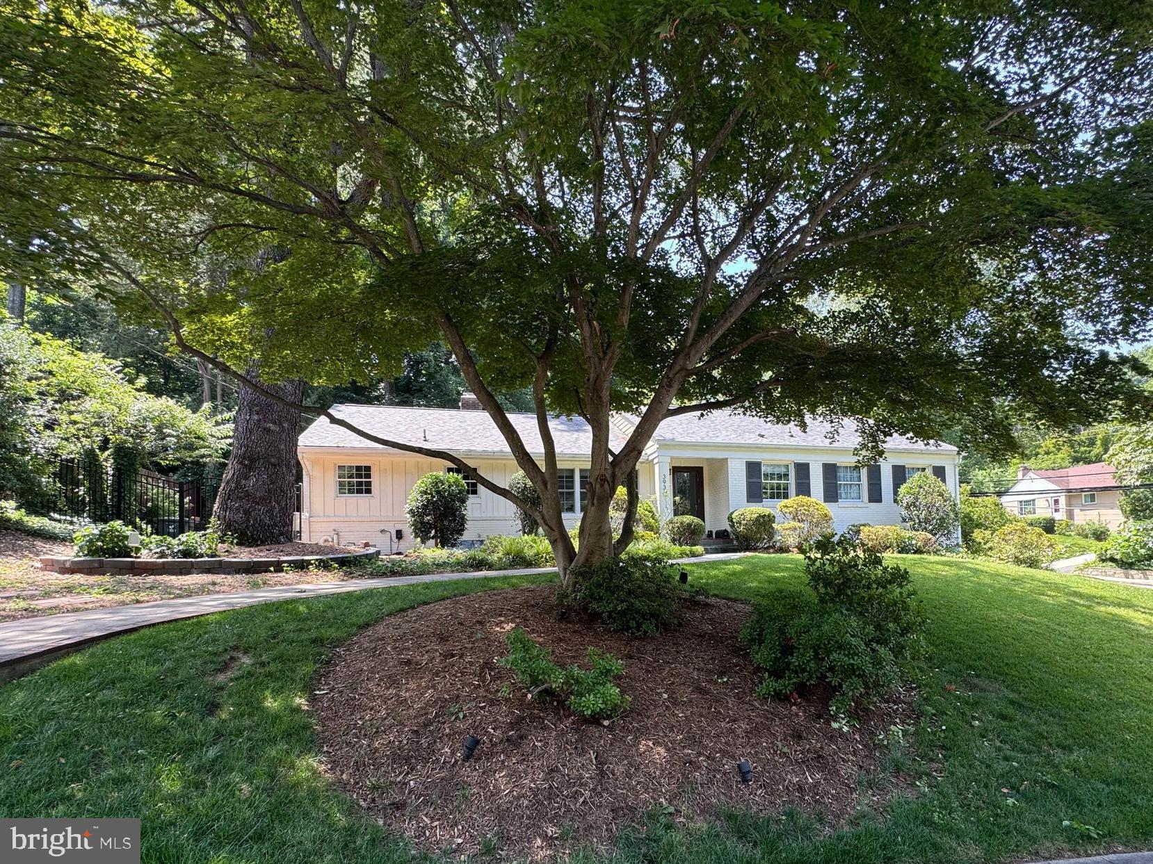 Professional photos to come. 
Active 7/23.  Open house 7/26 1-4pm

Nestled in the heart of Bellevue Forest, this beautifully renovated & updated Gene May brick rambler offers over 3,300 square feet of thoughtfully designed living space on a professionally landscaped .35-acre corner lot.

Inside, you will find a stunning newly renovated property. A welcoming foyer greets you and your guests, while a formal dinging room with new lighting opens to a crisp white modern kitchen, there is newly refinished hardwood floors throughout the main level, new recessed lighting, and four fireplaces create warm, inviting living spaces. The elegant living room is open to the dining room and kitchen, and  features a stunning wall of custom built-ins, while a dedicated home office with a fireplace provides an ideal work-from-home space or flexible bonus room. Also located on the main level is the updated primary suite with full bath, two additional secondary bedrooms and a renovated hall bath. 

The expansive walk-out lower level offers a spacious recreation room with built-ins, fourth bedroom, full bath, mudroom area off two car garage, abundant storage, and direct access to the backyard.

Designed for both entertaining and everyday enjoyment, the outdoor spaces are exceptional. Multiple slate patios, extensive hardscaping and landscape lighting, a lighted sport court, hot tub, and a large shed with electricity create a private backyard retreat. The side-loading two-car garage is outfitted with GarageTech flooring and custom wall storage for exceptional organization.

The kitchen was completely renovated to include all new cabinets, new appliances, quartz countertops, under cabinet lighting, custom backsplash and new lighting. (2023/2024- except the stove is from 2017)
Extensively improved over the years, the home also features replacement windows and exterior doors, roof (2020), HVAC (2019), hot water heater (2022), gutters (2022), refinished hardwood floors, upgraded landscaping, and numerous additional enhancements. A pull-down attic provides generous additional storage.

Ideally located just one traffic light from Washington, DC, with ART bus service just steps away, this exceptional home is within the highly regarded Jamestown Elementary, Williamsburg Middle, and Yorktown High School pyramid and offers convenient access to parks, shopping, dining, and major commuter routes.