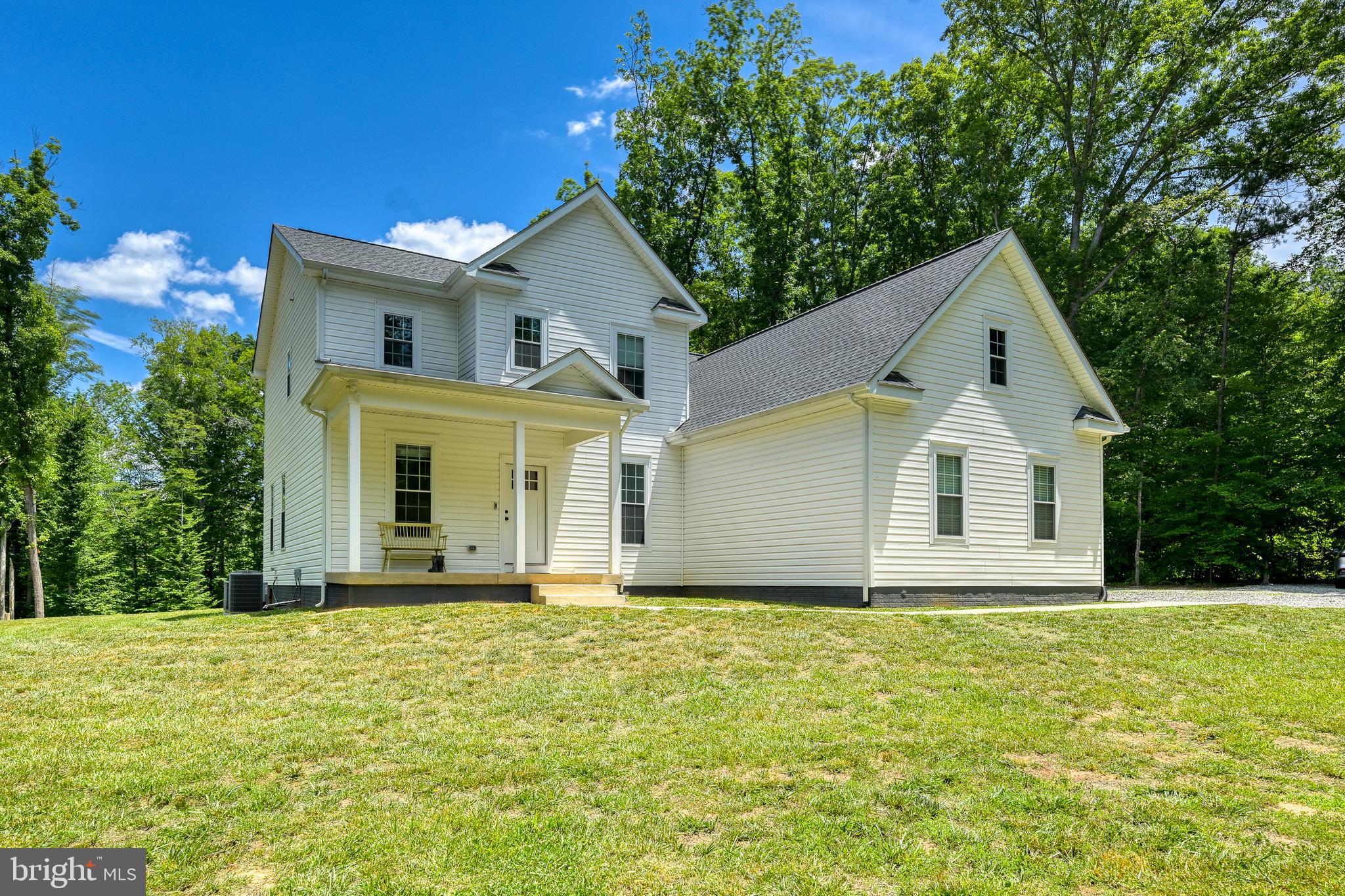 Escape to the peace and privacy of country living on nearly 7 wooded acres with a natural spring, established trails, and thoughtful upgrades throughout. This well-appointed home offers the perfect blend of modern efficiency, comfort, and outdoor recreation. Inside, you'll find durable luxury vinyl plank flooring throughout, tile bathrooms, and elegant quartz countertops in the kitchen and all bathrooms. Spacious walk-in closets provide ample storage, while the open and functional layout is designed for everyday living. Built with efficiency in mind, the home features a conditioned crawl space, upgraded high-efficiency spray foam insulation and a Jøtul high-efficiency dual-burn Norwegian wood stove for exceptional comfort and reduced energy costs. For added peace of mind, the property is both prewired for a Generac standby generator and equipped with a generator hookup, offering flexible backup power options. The 700 sqft unfinished bonus room above the primary suite and garage already includes electrical service and is prewired for a mini-split system, providing an excellent opportunity to create additional living space, a home office, gym, or guest suite. Outside, enjoy the beauty of the wooded acreage, natural spring, and trail access extending to the rear of the property. Additional features include a 2-car garage, a 2-car carport ideal for tractor, equipment, or firewood storage, and established chicken runs for those seeking a homestead lifestyle. Whether you're looking for a private retreat, hobby farm potential, or simply room to roam, this unique property offers modern conveniences in a beautiful natural setting. Schedule your private showing today.