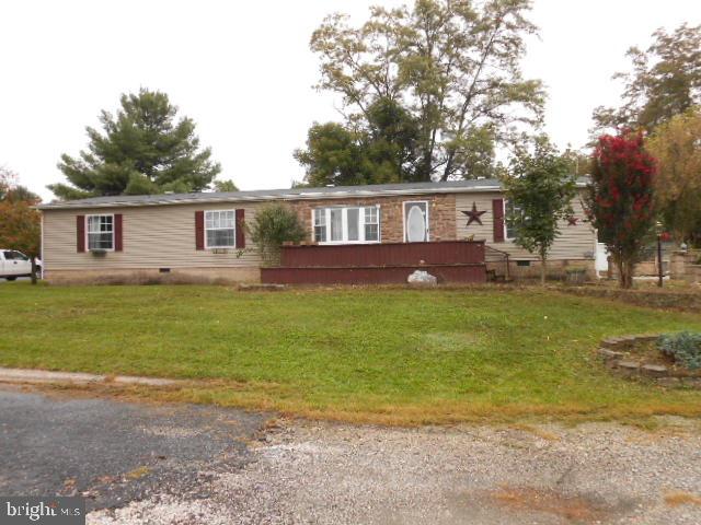 1985 Double Wide with Stick Addition.  Remarkable Eat in Kitchen, Dining Rm, Living Rm, Family Rm, Den, Four Bedrooms, 2.5 Bathrooms, Master Suite, Off street parking, Cathedral Ceilings, and more.  Home does need some work.