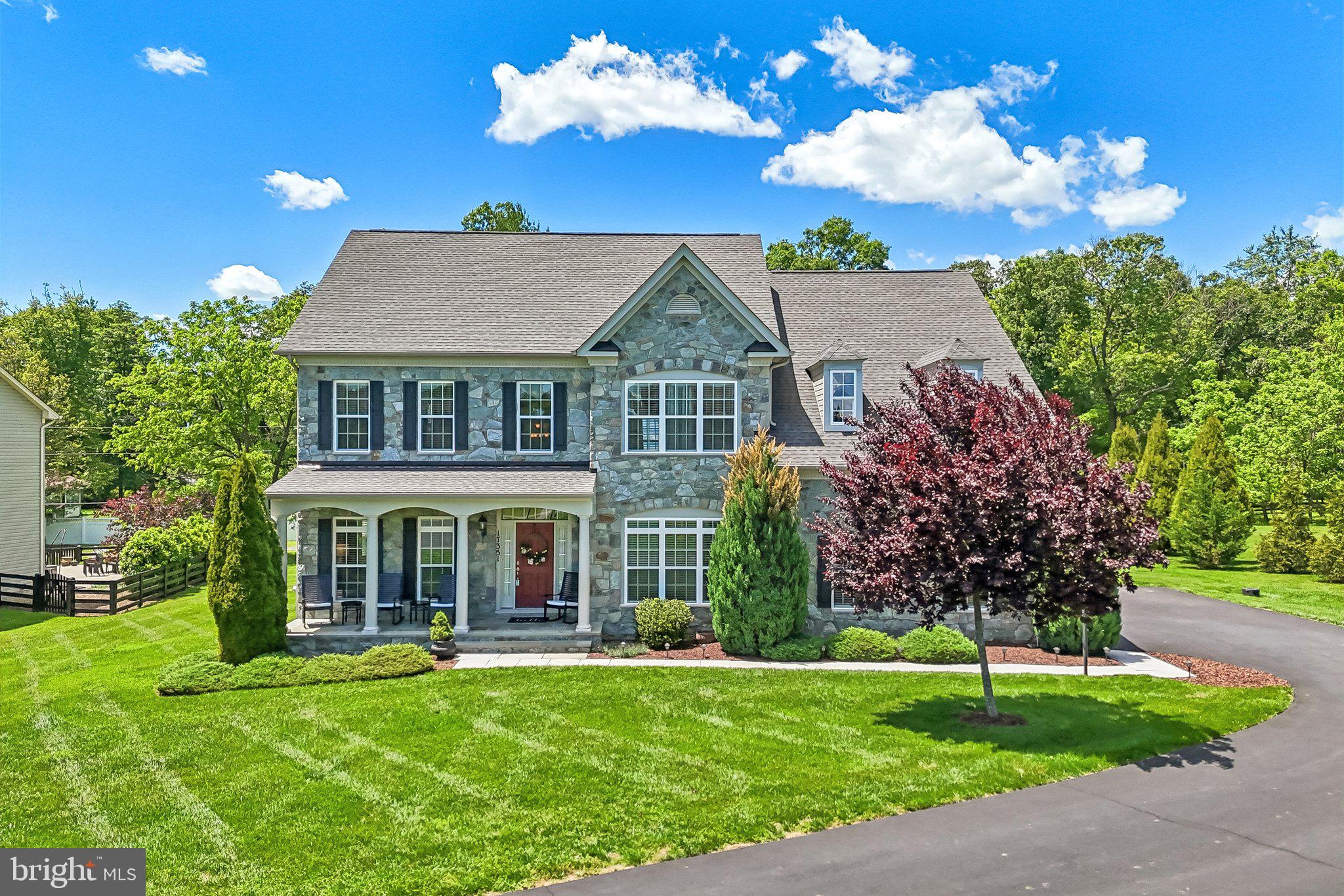 Elegant 2017-Craftmark built luxury home on 1.31 acres in sought-after Hamilton! With nearly 5,000 sq ft of beautifully finished living space, this 4BR/4.5BA residence offers the perfect blend of refined design and everyday comfort. A striking stone front and welcoming front porch create a memorable first impression.

Inside, rich hardwood floors, deep crown molding, and detailed trim work elevate the main level. The light-filled gourmet kitchen features high-end appliances, expansive granite countertops, a large center island, and breakfast area, all flowing seamlessly into the spacious family room with a stunning stone gas fireplace. French doors open to a beautiful deck overlooking the private backyard—ideal for entertaining, with ample space for a future pool. Formal living and dining rooms plus a private office provide flexibility for both everyday living and special occasions. Mudroom leads to a 2-car garage with epoxy flooring.

Upstairs, the expansive primary suite is a true retreat with two generous walk-in closets and a luxurious spa bath featuring a soaking/jacuzzi tub and separate shower. Three additional bedrooms include one en-suite and two sharing a hall bath, all with large closets. Convenient bedroom-level laundry.

The finished lower level offers a large rec room with a second stone gas fireplace, full bath, and a versatile bonus room (non-legal 5th bedroom) perfect for a guest space, gym, office, or craft room.

Enjoy the charm of small-town living with the convenience of nearby amenities—just minutes to the heart of Hamilton and a short drive to Purcellville’s shops, restaurants, groceries, and everyday services. Nearby parks, playgrounds, and access to the W&OD Trail provide abundant outdoor recreation opportunities, while major commuter routes remain easily accessible.

A rare opportunity to enjoy space, quality, and privacy in a beautiful Loudoun County setting.
Due to weather, professional exteriors photos, video, matterport & drone to be added Friday, May 29th.