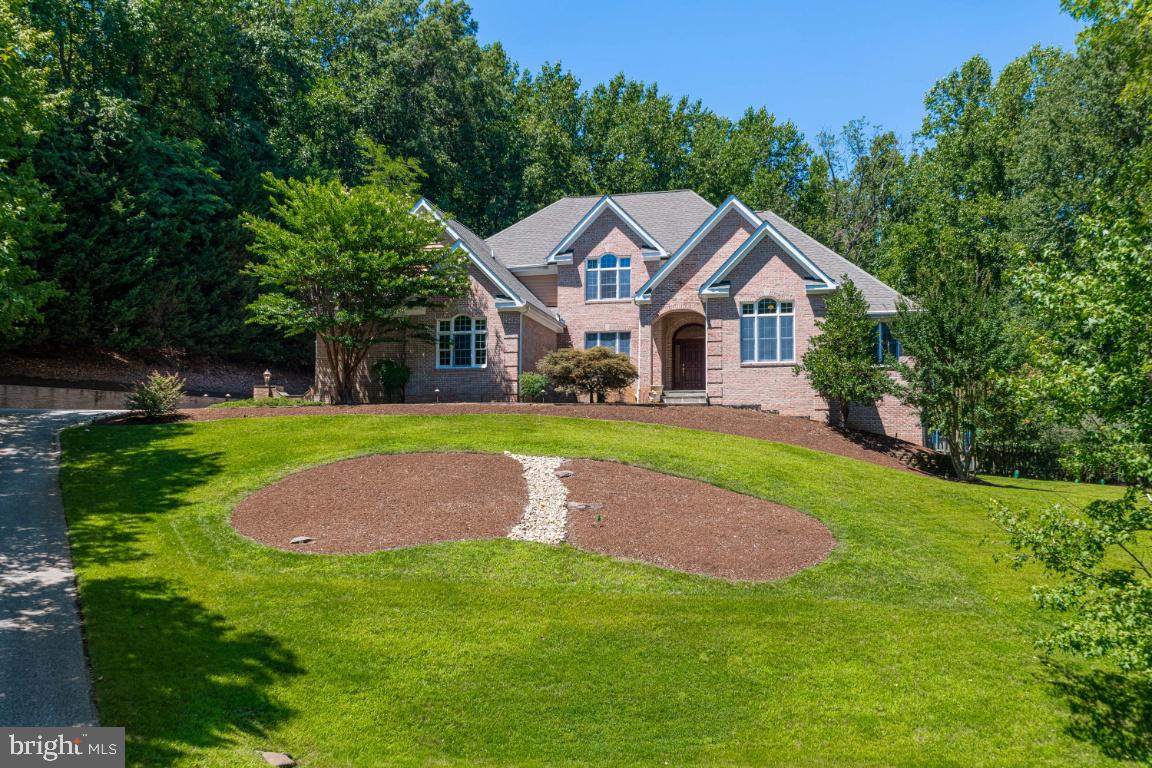 Welcome to 1602 Upton Scott Way !! A Spectacular All Brick Colonial Home on 1.28 Acres in the Water Priviledged  Community of Belvoir Farms. This Home has it all. Over 7000 sq feet of Living Space, 5 Bedrooms and 4.5 Baths, Enter to a 2 Story Hardwood Foyer with a Custom Turning Staircase. First Floor Master Suite with Tray Ceilings ,Sitting Room, Walkin  Closets, Double Vanities, Soaker Jacuzzi Tub and Separate Shower, Large Den / Study ,Formal Dining Room, Wine Fridge and wet Bar, Gourmet Kitchen with Granite Counters, Double Ovens ,Gas Cooktop and Custom Range Hood, Large Family Room off Kitchen with a Raised Hearth Brick Wood Burning Fireplace, Walkout to your Backyard Oasis !! Large Private Deck for Relaxing a Beautiful Updated Redone Heated Pool with New Decking, Diving Rock  and Major Hardscape. Rod Iron Fenced Rear Yard with Huge Custom Fire Pit and New Hot Tub.3 Large Bedrooms on the 2nd Level with Vaulted Ceilings .Fully Finished Basement with Raised Hearth Brick Wood Burning Fireplace. Full Kitchen and Bedroom with Full Bath. Main Level Laundry Room,4 Car Garage, Paved Driveway, Generator. This Home is Just a Pleasure to Show, Close to Restaurants, Annapolis Historic District ,City Dock and The United States Naval Academy, Good Commute to Washington DC, Baltimore, Fort Meade and NSA. *(Updates in Pool Area).* Pool Heater and Sand Filter in 2019, Pool Pump in 2020, Polaris vacuum and Pump 2019, Timers 2020, Pool Coping and Tile Replacement 2019, Landscape Lighting $7800.00 in 2019, Pool Patio and Deck Extension ,Walkway to Backyard ,Fire Pit, Rock River Bed Hardscaping,$100k in 2019,Hot Tub 2019 $ 8k,Water System Upgrade, All Brand New except for Containers 2018, HVAC 2 of 3 zones  replaced 2018 & 2019, Washer Dryer 2018, Main Floor Refrigerator 2019, Stand up Freezer 2019, Speakers thru out the Home and Deck $15,k, Magnolia Speaker and Internet System ,Including Fully Wired Ethernet Outlets & Mesh WiFi Network that reaches the Pool. $60k.