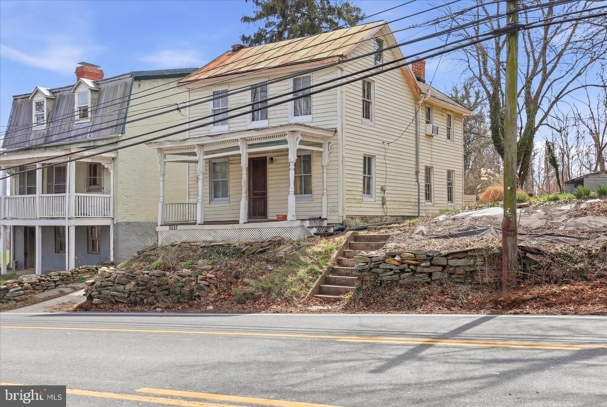 Great Investment Opportunity! This charming home, built in 1900, offers incredible potential for investors/buyers looking to add value. With approximately 1,596 square feet, this single-family property features three bedrooms and one full bath on the upper level. The main level includes a kitchen, eat-in area, den, laundry room, and living room, all ready for your vision. Conveniently located on Old National Pike and minutes from shopping, dining, and recreation in Frederick, this property also benefits from no Frederick City taxes—a valuable bonus for investors and future owners.  

Being sold strictly “As-Is,” this home is ideal for renovation or modernization. Current features include a wood stove for heating, window A/C units, private well and septic, a cold water holding tank in the original dirt basement, a spacious front porch, and a private backyard with patio, parking area, mature trees, and abundant sunlight. This home requires a cash or renovation loan sale only.  

With creativity, vision, and effort, this property can be transformed into a desirable rental or primary residence. Don’t miss this opportunity to unlock its full potential at a price that gives you endless possibilities for transformation!