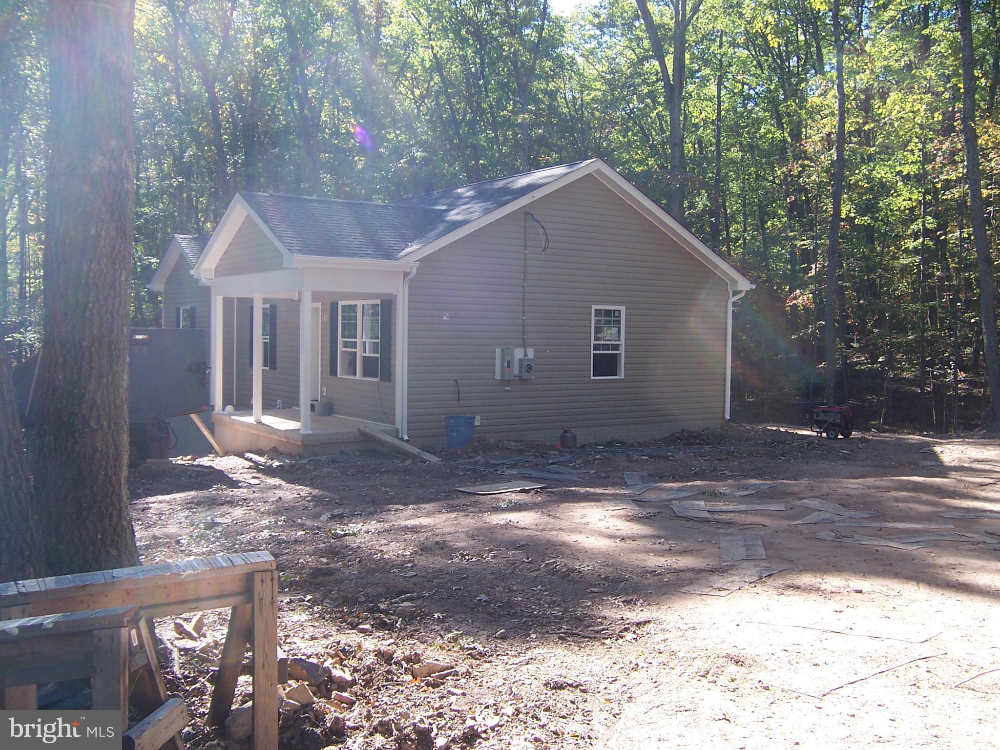 NEW RANCHER BEING BUILT ON TREEED 2 AC. LOT IN SOUTH  BERKELEY  CO. 3BEDROOMS  2 FULL BATHS  WITH ROUGH IN BATH IN BASEMENT FOR  LATER  USE- WELL - SEPTIC -  BUILDER WILL CONVEY  WITH   BERKELEY CO ENGINEERING AND BUILDING INSPECTIONS  -CERTIFICATE OF USE AND OCCUPANCEY  -ALONG WITH 1 YEAR  BUILDERS WARRENTY- MAST BEDROOM WITH FULL BATH AND WALK IN CLOSET-KITCHEN WITH ALL APPLIANCES  STAINLESS -BUYER  MAY HAVE  SOME PICKS IF NOT ORDERED AN WITH IN BUILDER  COST-SUB -DIVISION  IS  IN ACTIVE IN HOA  FEES -COVERANTS RUN WITH LAND- -WALK OUT BASEMENT- NO DECK INCLUDED IN THIS  SALE -PRIVATE LAST  LOT  OFF ALLEY WAY-SMALL WET WEATHER CREEK ON LOT-2 OTHER BEDROOM WITH OPEN DINNING AND LIVING AREA-GREAT KITCHEN --WILD AN WONDERFUL  WITH QUITE IN MOUNTAINS VA. LINE  WITH IN 8 MILES
