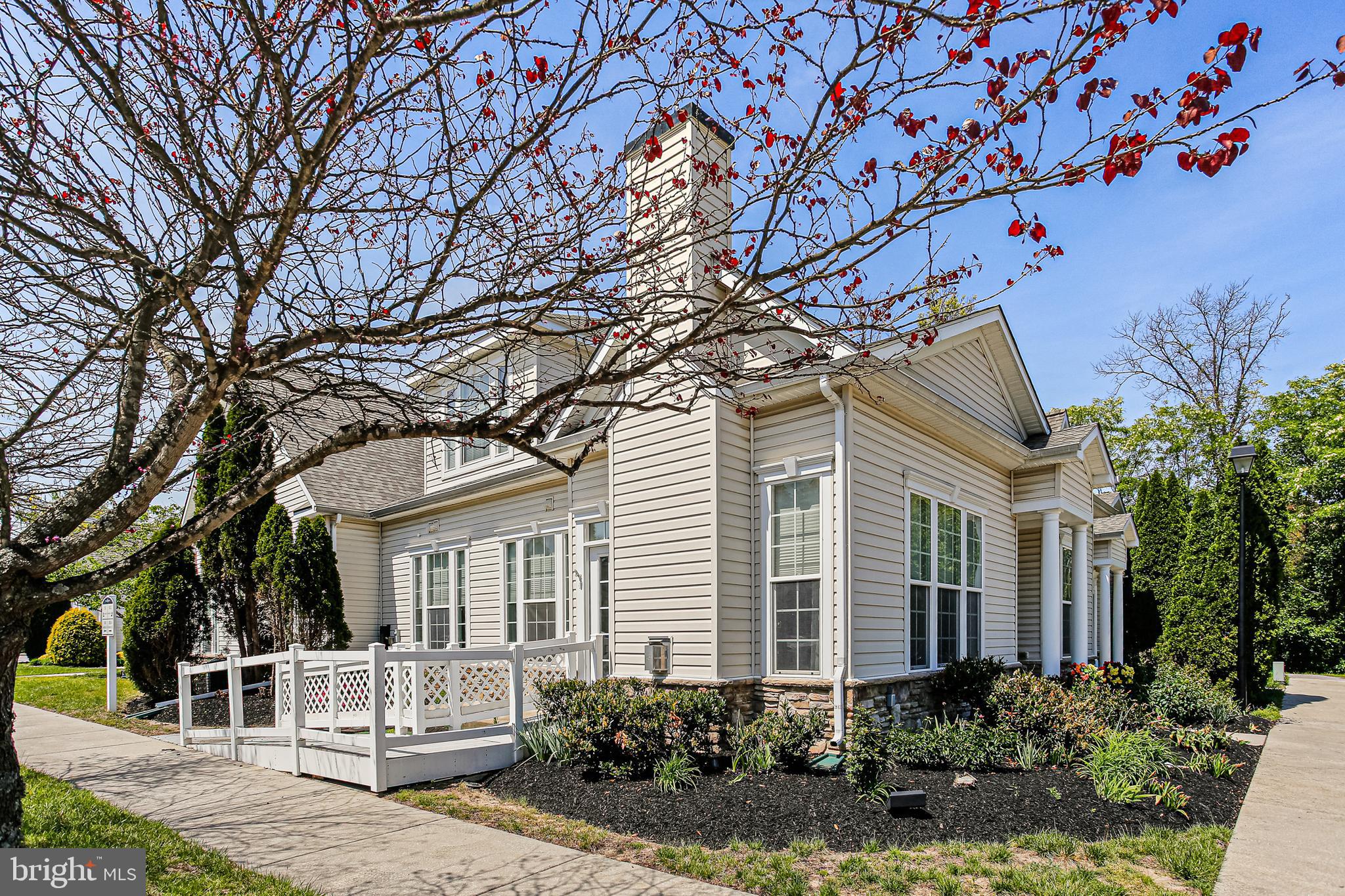 Beautiful  "Grayson" End Villa  with 3 bedrooms, 3 full bathrooms! Lovely maintained landscaping, 2 assigned   and extra guest parking .  Two  story foyer with lots of natural light and open floor plan!  French doors  to office /den, or you could use this room as another bedroom with direct access to the full hall bathroom.  Gourmet kitchen with  gas stove, all appliances, Corian counters, breakfast bar with pendant and recessed lighting and extra cabinets.  Tons of storage and table space  and door to patio. Spacious great  room , with  mounted flat screen TV wired for surround sound, and  gas fireplace. First floor primary bedroom with a tray ceiling, full bathroom, and an oversized  walk in closet. Separate first floor laundry room is located on the main level as well. Great for family and guests is the private upper level  loft, bedroom, and full bathroom. Second entrance from the patio to the Great room/kitchen area. Community center with gated pool . The conveniently  located Pearman's Overlook neighborhood is close to  shopping and major routes!   Route 100 & Route 10 and BWI.  It's move-in ready!