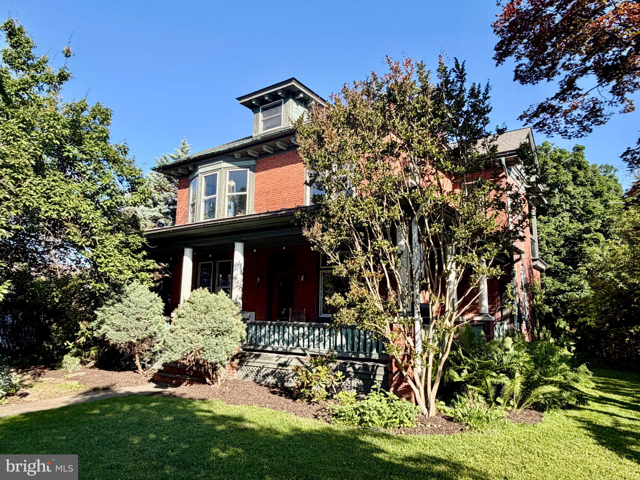 Welcome to 701 16th Street, a beautifully preserved 1904 home offering over 2,500 square feet of living space on a rare half-acre lot in the heart of New Cumberland.

This 5-bedroom, 2.5-bath home blends historic craftsmanship with thoughtful modern updates, including a renovated kitchen, a renovated third-floor primary suite, new second-floor carpeting, and a mini-split heating and cooling system.

Inside, you'll find stunning original chestnut woodwork, hardwood floors, vintage architectural details, and extraordinary 6' x 8' chestnut pocket doors separating the living and dining rooms. The spacious layout offers three finished levels, providing flexibility for family living, guests, home offices, or hobbies.

Outside, enjoy a large wraparound front porch, a covered second-floor porch, mature landscaping, established gardens, and a fully fenced backyard on an uncommon 0.52-acre lot. Whether entertaining friends, gardening, or simply relaxing, the outdoor spaces are designed to be enjoyed year-round.

Located within walking distance of downtown New Cumberland's shops, restaurants, theater, library, parks, and numerous schools, this home offers the charm of small-town living with convenient access to Harrisburg, major highways, and outdoor recreation along the Yellow Breeches Creek and Susquehanna River.

Historic homes with this level of character, space, and walkability rarely become available. Schedule your showing today.