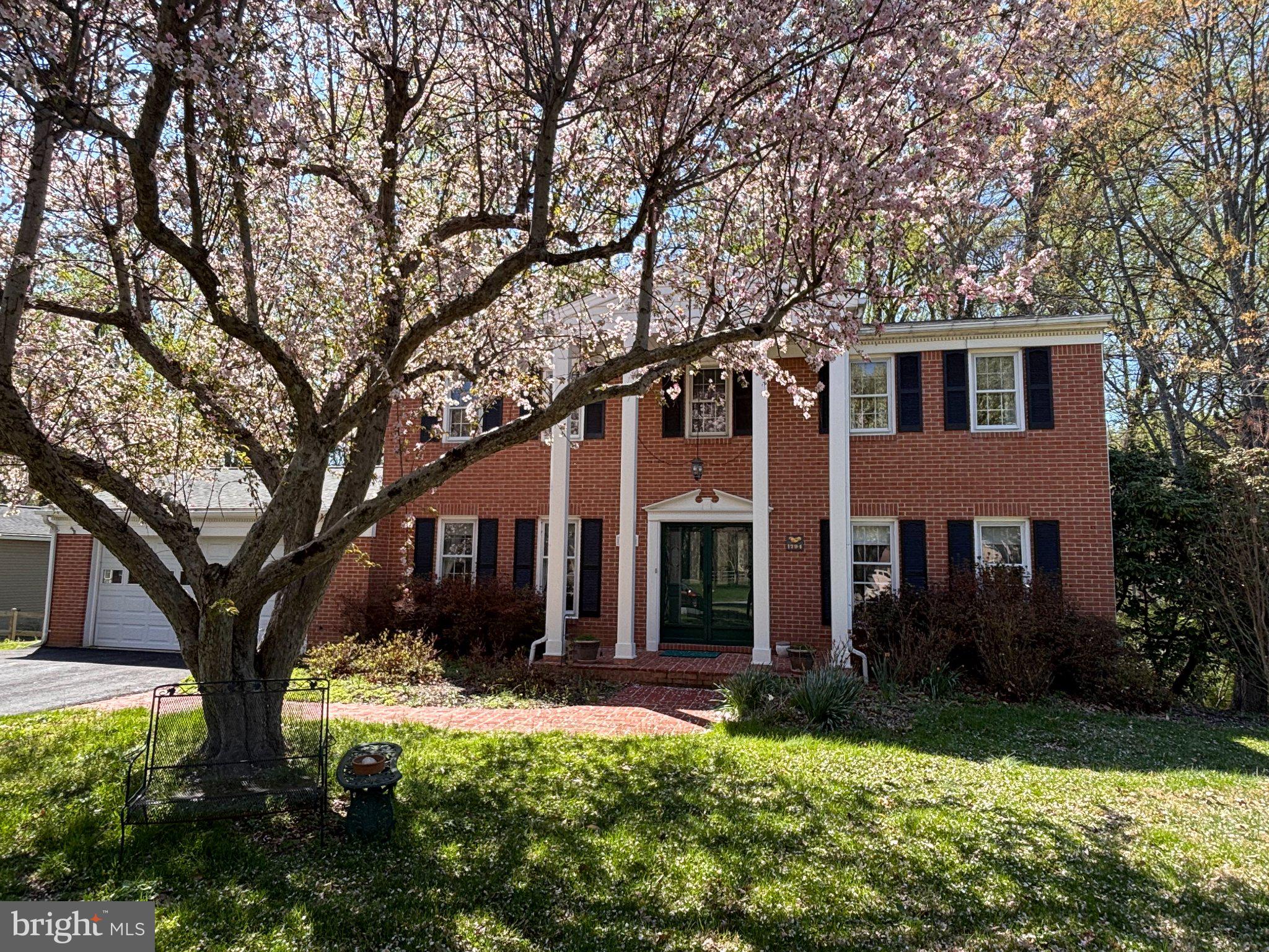 Welcome to 5076 Lake Circle West in Beaverbrook! A stately Colonial on a gorgeous half-acre lot with contemporary flair. This lovingly maintained home, owned by the same family for over 40 years is an absolute jewel, that offers something for every lifestyle. Located in Beaverbrook, one of Howard County's most desirable neighborhoods. The home sits on a gorgeous half acre lot featuring a picture book front lawn for enjoying the neighborhood. In the rear of the home is a private backyard, sloping into a generous copse of woods that host a gentle stream. The Beaverbrook Pond, stocked with fish, is just yards away and at the end of the street lies a natural path leading to Wilde Lake, just a 10-minute walk from the front door. Centennial Lake lies just across Rt. 108 a 5-minute bike ride from the front door. Enjoy all of Columbia's amenities - bike/jogging trails, lakes, interconnectivity, proximity to pools, gyms etc., but pay NO CPRA! This neighborhood is an outparcel and is exempt from Columbia Association assessments and covenants. Inside the home you'll find a spacious, meticulously maintained and stylishly updated home. Hardwood floors dominate the main level, complementing the traditional floor plan. A cozy family room featuring  a fireplace with a brand new sleeve. A bright living room with French Doors, that opens to the formal dining room featuring a built in corner cabinet connects to the modern kitchen with spectacular custom cabinets and an oversized pantry featuring pull out shelves overlooks the incredible sun room. The large 23x14 sun room features 4 custom sky lights and hardwood floors and gives this staid colonial a contemporary flair. Upstairs are 4 large bedrooms. The master bedroom features a walk-in closet and updated master bath. The hall bath was also recently updated and the secondary bedrooms are large and bright with newer carpet. The large lower level is finished, with a full bath, wet bar and a bonus room perfect for a home gym, workshop or crafting space. The utility room showcases ample storage space and a newer water heater (2020) and boiler (2020) as well as a replaced oil tank (also 2020). Recently replaced roof, water heater, boiler, brand new sleeve in the chimney (2026) and a resurfaced driveway as well as a gorgeous Sunroom for entertaining - this gem of a home is ready and waiting for its new owners!