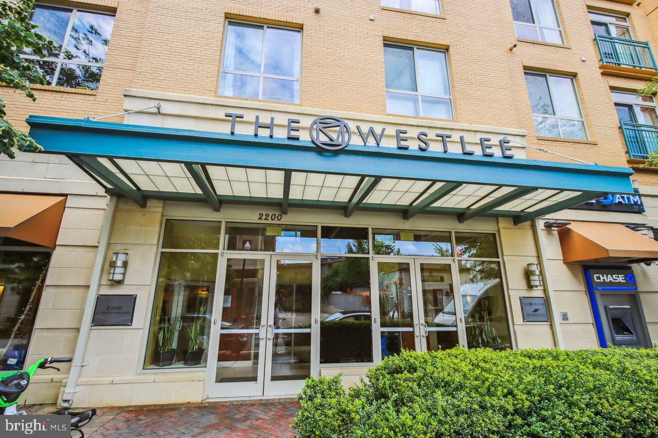 Rarely available 2 bedroom/2 bath + den unit at The Westlee! This spacious and bright condo features an open floor plan with central updated kitchen including granite counter tops, stainless steel appliances,  island and pendant lighting.  The living room enjoys floor to ceiling windows and  is bookended by two generously sized bedrooms, each with their own en suite baths, and an additional den offers a perfect flex space for an office/craft room/nursery!  Laundry is conveniently located in the unit as well!  With gleaming hardwoods, brand new carpet and fresh paint, this condo is move-in ready and a perfect blank canvas ready for the next owner. One garage parking space and unbelievable location just a short walk to the East Falls Church Metro, numerous shops and restaurants nearby (including the brand new Whole Foods at Broad St.),  and the W&OD! Please note the Westlee has a pet policy of one pet per unit, no larger than 25lbs.