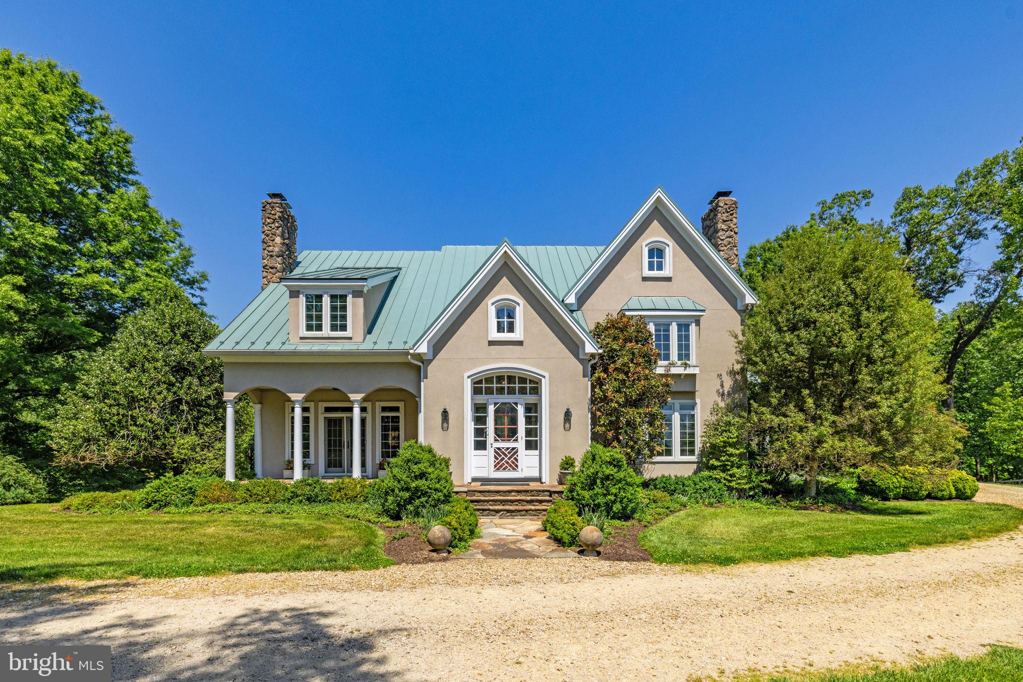 Set on 12.9 private, rolling acres in Virginia’s premier horse country, this well-appointed three-level stucco home perfectly pairs timeless country aesthetics with state-of-the-art modern luxury. Originally built in 1992 and topped with a premium standing-seam metal roof, the residence has been spectacularly reimagined with top-tier architectural upgrades, offering a flawless turn-key lifestyle for the discerning buyer.

As you enter through the field stone columns, you are greeted with beautiful, landscaped gardens boasting established hardwoods, flowering dogwoods, weeping cherry, crabapple and redbud varieties, including large and small boxwood bushes, and various perineal plantings.  This backdrop provides charm, privacy and a revolving seasonal landscape.

Upon entering the home, you are immediately welcomed with style, form and function, including multiple coat closets, front and back staircases to the upper living areas, walk-in kitchen pantry and an open design concept that flows seamlessly for family and formal living. 

The heart of the home underwent a complete, full-scale architectural transformation, offering an effortless layout optimized for grand-scale entertaining and warm everyday life.

These improvements include a gourmet kitchen with light and airy quartz countertops, a hammered stainless steel metal center island, custom cabinetry and state of the art kitchen appliances. 

The open-style kitchen flows into the adjoining breakfast room, den, dining, living and powder rooms highlighted with designer spaces that are uniquely styled. Hand hewn beams, custom painted hardwood flooring, shiplap walls, built in bookshelves, two working wood fireplaces, a mudroom/ laundry room and an attached two car garage are all part of this beautifully tailored home.

Large windows and French doors throughout create open and airy spaces with views of the separate gardens and outdoor entertainment areas. The back deck with a lovely, draped wisteria trellis overlooks your private three board fenced rolling pastures and views to the west. 

The two custom-designed stairwells serve as striking centerpieces, anchoring the home's transition to the upper quarters.

The upper level is designed with family and guests in mind, featuring a master suite, private guest room with full bath, a playroom/entertainment area and two additional bedrooms linked together by a jack and jill bath.

This entire upper level recently underwent a complete top-to-bottom redesign showcasing antique ceiling beams, custom shiplap wall treatments, marble bathroom flooring, custom vanities with upgraded lighting and designated media areas, marrying historic warmth with clean, modern lines.

Enjoy your private primary bed and spa like bath with a large dressing room off the bathroom. The primary bathroom is an oasis of luxury, anchored by premium marble tile flooring, upgraded designer lighting, and elite plumbing fixtures.

Included with your turnkey home, enjoy a fully finished walk out basement living area including custom hand painted cabinetry in both the wet bar and media/den areas. These areas are enhanced with a copper sink, soapstone countertop, a field stone custom gas fireplace  tv area, a separate wine room and cedar closet.  
Also included in this space is a large game room area, a full bathroom with stand-up shower and large storage utility rooms.

Dime Box is a beautiful, private family home custom designed with indoor and outdoor living areas to embrace the breathtaking Virginia countryside.