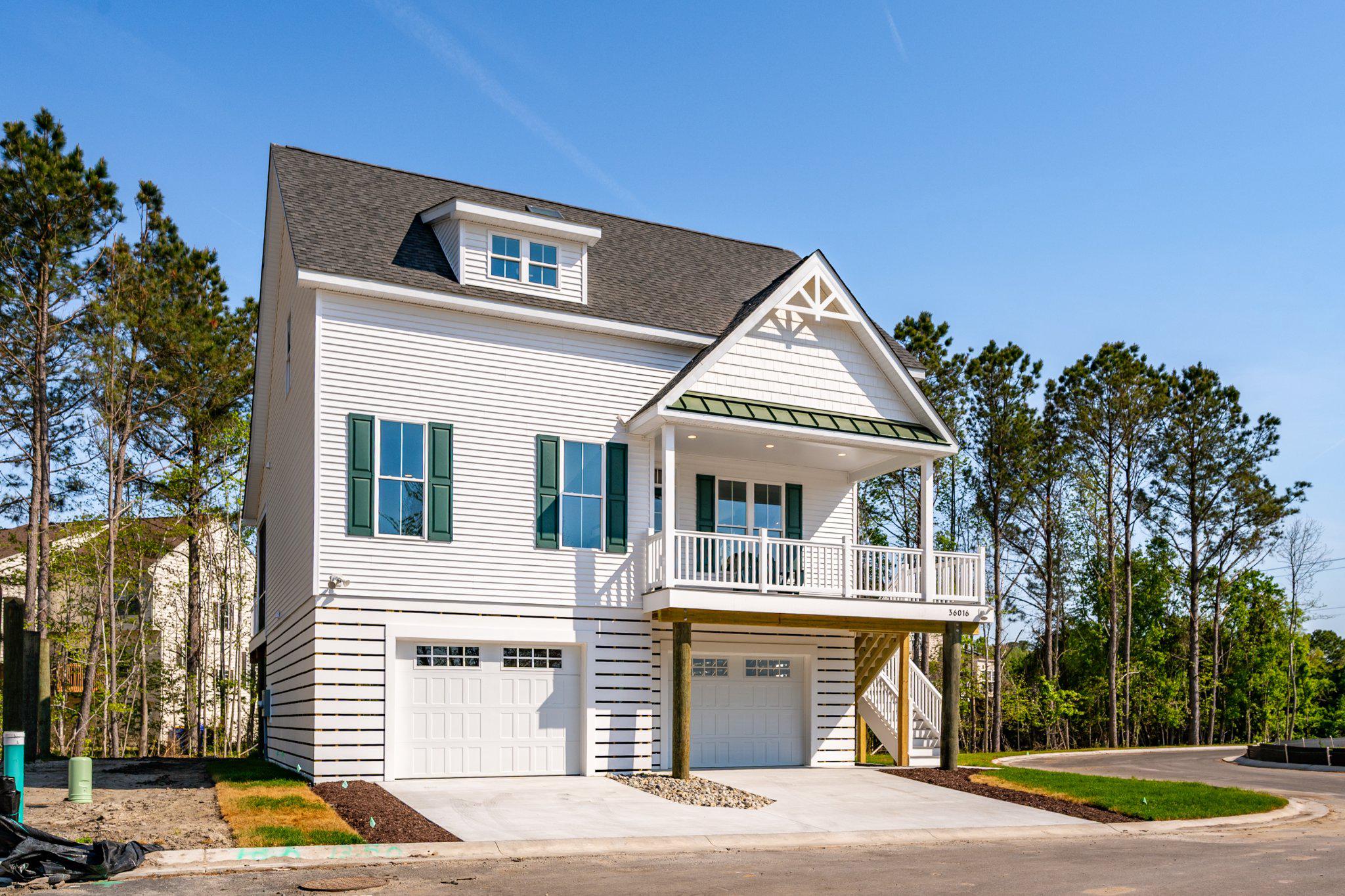 Only 16 families will call Seychelles their beach home and vacation getaway. Seychelles Bethany Beach might remind you of that old beach house you visited as a kid, but it’s a totally modern take on the style. Nestled on sturdy pilings with plenty of covered guest parking and a bunch of cool amenities like decks and porches, the Seychelles Bethany Beach homes are the perfect family getaway by the sea. This is the open-concept layout you remember, complete with a welcoming eat-in kitchen, a dining area for 10, and spacious bedrooms and bathrooms designed by a skilled and trustworthy Bethany Beach, DE home builder.

We have two awesome options for you to choose from. The Freeport I model has a 3-bedroom layout. The master bedroom is on the main level, and it has 2,175 square feet of living space.  The Freeport II model, is a 4-bedroom layout, increasing the square footage to 2,306 and adds a 4th bedroom and an extra full bath to the home.  The 4-bedroom price is $699,000.  Both options have some really cool features, like luxury vinyl plank flooring on the first floor, bedrooms are carpet, ceramic tile in all bathrooms, and two more spacious bedrooms with walk-in closets on the second level. There’s even a full bath and laundry room there! The kitchen has stainless steel appliances, a 4 x 8 island with quartz countertops, and a spacious dining area.

This home also has a lot of extra space. It’s built on pilings that offer over 1,500 square feet of enclosed garage space, an outdoor shower and shed for storage, a screened porch on the rear deck, and a covered front porch for your morning coffee.

What are you waiting for?