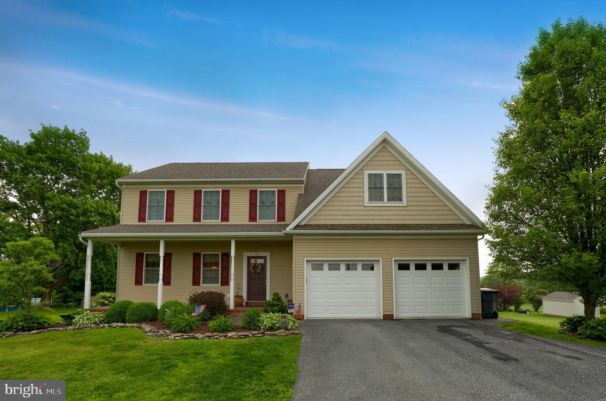 This 4 bedroom home offers a quiet country setting and features a welcoming full front porch that creates an inviting curb appeal.  9 foot first floor ceilings create bright and spacious rooms. Gorgeous hardwood floors throughout the first level. Large open kitchen features stainless steel appliances, island with seating and plenty of pantry storage. Sunken family rom features a cozy fireplace and large glass doors lead to sizable, low maintenance composit deck. Large hot tub is great for relaxing and overlooking the open backyard