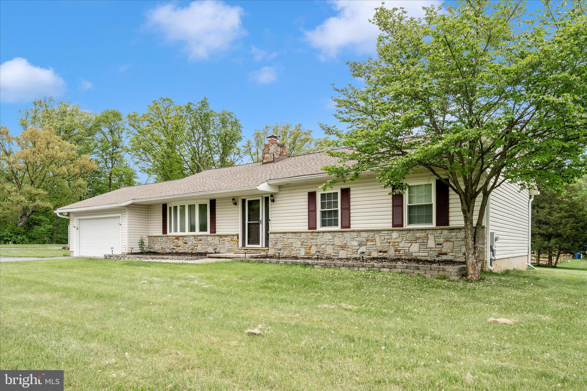 OPEN HOUSE CANCELLED****Under Contract*****This charming ranch-style home offers easy, one-level living on a beautifully level 1.19-acre corner lot in a highly convenient Mount Airy location. From the moment you arrive, you’ll notice the inviting curb appeal, expanded driveway with ample parking, and a detached garage perfect for additional storage or workspace.

The spacious, open yard provides endless opportunities for gardening, outdoor recreation, or simply enjoying the peaceful surroundings. Inside, a welcoming foyer leads into a bright and airy living room featuring a stunning bay window and a cozy wood-burning fireplace. The living room flows seamlessly into the dining area—ideal for gatherings with family and friends.

The kitchen offers table space and access to a large 500 SF rear deck through an atrium glass door, creating the perfect setting for outdoor dining, entertaining, or relaxing. The generously sized primary bedroom easily accommodates a king-size bed with additional furnishings, and includes an updated en-suite bath with a walk-in shower. Two additional bedrooms and a full hall bath complete the main level.

Downstairs, the unfinished lower level features high ceilings and a walk-up exit to the backyard, offering a blank canvas for future customization. With no HOA, plenty of space for pets and play, and close proximity to shopping, dining, and I-70, this home combines comfort, convenience, and potential.

Some updates include - well pump 2026; sump pump 2026; replaced deck flooring, joists, and railing in 2025;  water heater 2025; heat pump 2022;  Acid neutralizer and water softener 2023; roof 2018.

Well-maintained ranch homes like this are a rare find—don’t miss your opportunity to make it yours!