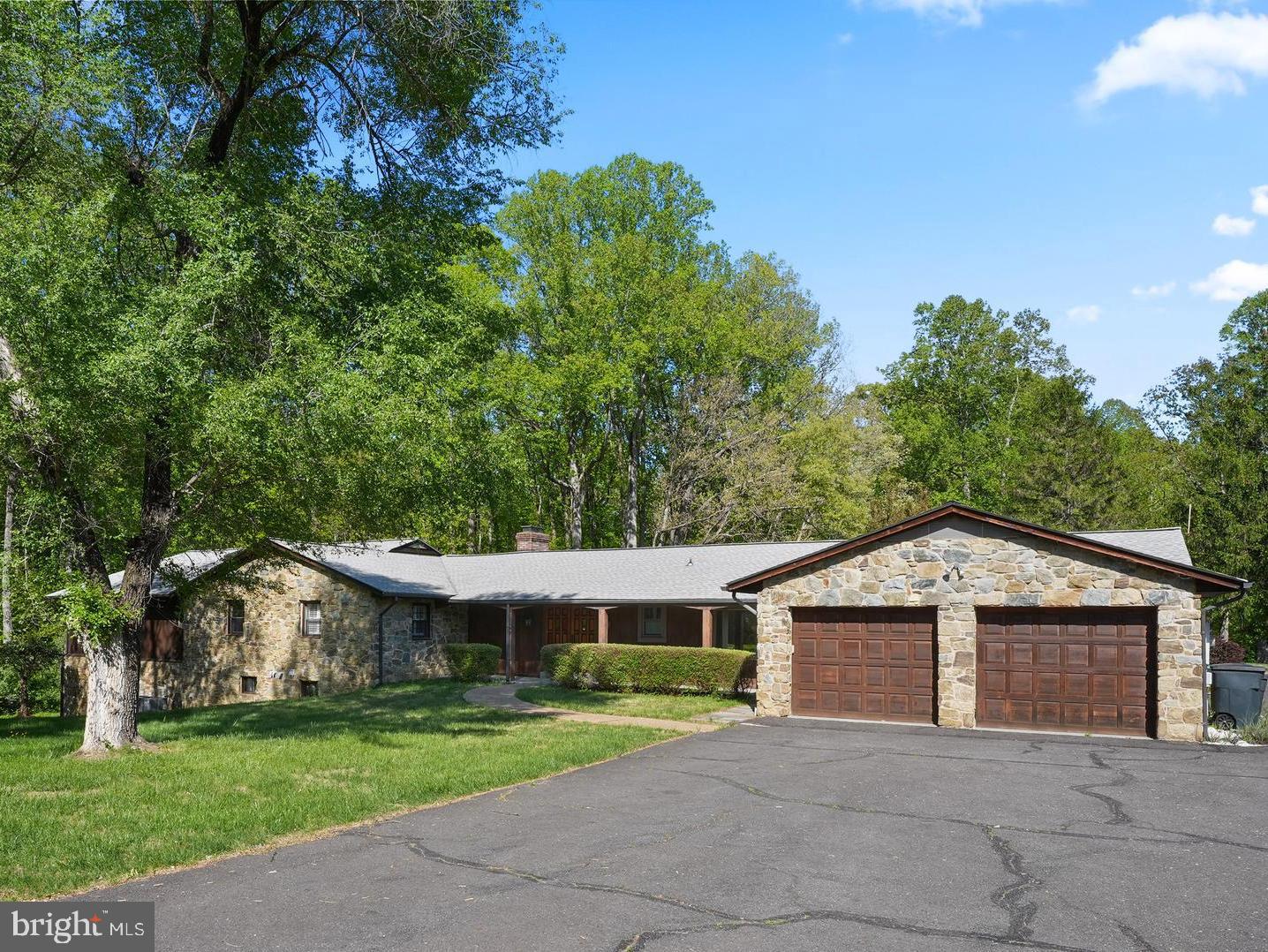 $250,000 PRICE REDUCTION!

A rare opportunity to own a 7+ acre private estate in Clifton, Virginia with an indoor and outdoor pool. This property also features a fully separate 30x60 two-level warehouse, ideal for business owners, car collectors, contractors, or anyone needing serious workspace at home.

This 5-bedroom, 5 full bath and 2 half bath home with nearly 4,000 main level square feet delivers the kind of flexibility today’s buyers are actively searching for: multi-generational living, work-from-home functionality, and resort-style features.

Set on 7.04 wooded acres, the property offers complete privacy while still being conveniently located near Fairfax, Centreville, and major Northern Virginia hubs.

Inside, the home features expansive living spaces designed for both everyday comfort and entertaining. A standout feature is the indoor pool, creating a year-round retreat rarely found in Clifton homes.

Additional highlights include:

-Second kitchen ideal for extended stays or multi-generational living
-Spacious bedrooms with multiple ensuite baths
-Functional layout with room for office, gym, or guest suites
-Attached garage + ample outdoor space for future expansion or customization

Built in 1964 and thoughtfully maintained, this property blends classic construction with modern flexibility, making it ideal for buyers looking to personalize and add long-term value.
