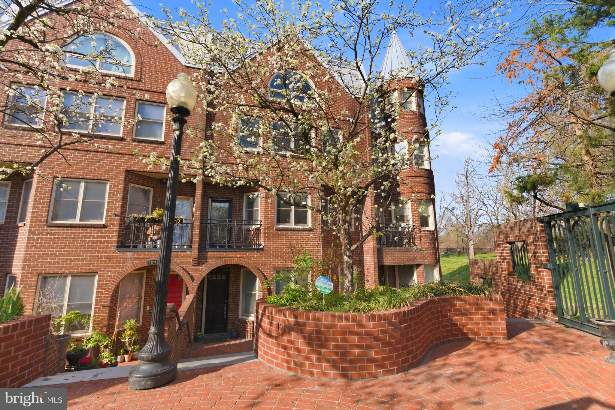 Welcome to this elegant Georgian style townhouse located in the heart of Georgetown designed by acclaimed architect, Arthur Cotton Moore and built in 1986. Renovated in 2022 with top-of-the-line finishes this nearly 3,300 sq ft residence features 4 spacious bedrooms each with en-suite baths, 2 powder rooms, an elevator to all 4 floors, plus two garage parking spaces. French oak hardwood floors are seen in every room of the house along with charming crown moulding (principal rooms) and recessed lighting. Entering the main front door a cozy foyer includes a walk-in coat closet and leads to the first of two powder rooms along with elevator access. A stunning family room with herringbone French oak hardwood floors, crown moulding, recessed lighting and in-ceiling speakers lies just beyond and has 2 sets of French doors leading to a private and serene patio with teak floor, built-in planters and outdoor speakers. The first bedroom of the home is located on this level and provides a generous space and bright atmosphere with south facing bay front windows and includes an en-suite Porcelanosa bath with shower and tub. Ascending a gentle staircase to the second floor the main entertaining space features an expansive living room again with herringbone pattern French oak hardwood floors, crown and picture moulding, large south facing bay front windows creating a light and airy feeling, recessed lighting and in-ceiling speakers. A glass door leads to a step-out living room balcony yielding lovely tree top and plaza views. A luxurious gourmet Porcelanosa kitchen provides plentiful cabinetry and counter space and is equipped with Thermador and Bosch integrated and built-in stainless-steel appliances. A large center marble island with seating for 3-4 plus additional storage is a focal point with its designer glass chandelier. For added convenience a butler’s pantry with yet more cabinetry and a wine fridge is located between the kitchen and living room excellent for entertaining. Open to the kitchen is the dining room which easily accommodates 6-8 guests. Going to the third floor the spacious primary suite again features French oak hardwood floors, crown moulding, recessed lighting and in-ceiling speakers. Plentiful closet space is provided by 2 double closets flanking the stone fireplace, a walk-in-closet and an additional large closet all with built-in closet systems. A luxurious spa inspired soothing gray stone and marble ensuite bath indulges with a double vanity, large frameless glass walk-through shower and a free -standing designer soaking tub. On the same floor the third bedroom is located with 2 sets of double door closets with built-ins and  an en-suite Porcelanosa bath with large shower. The fourth floor includes a fourth bedroom with en suite Porcelanosa bath with large shower, walk-in-closet and additional double door closet. Completing this floor is a large private roof deck with teak flooring, outdoor speakers and stunning views of charming Georgetown rooftops and lush Rose park. Convenience is assured with 2 full-size side-by-side garage spaces.  Additional details of the home include elegant light grey roman shades (Shade Store) throughout, security system, ring video doorbell, WIFI programmable HVAC systems with Aria vents along with security gated entrances. The townhouse is part of a Homeowners Association with a monthly fee of $1,129 that covers exterior maintenance , snow and trash removal, insurance and reserves. This property is ultra-conveniently located in in the heart of Georgetown with numerous stores, shops, restaurants and the Four Seasons just steps from your front door, as well as, in close proximity to Reagan International Airport, downtown Washington and Union Station.