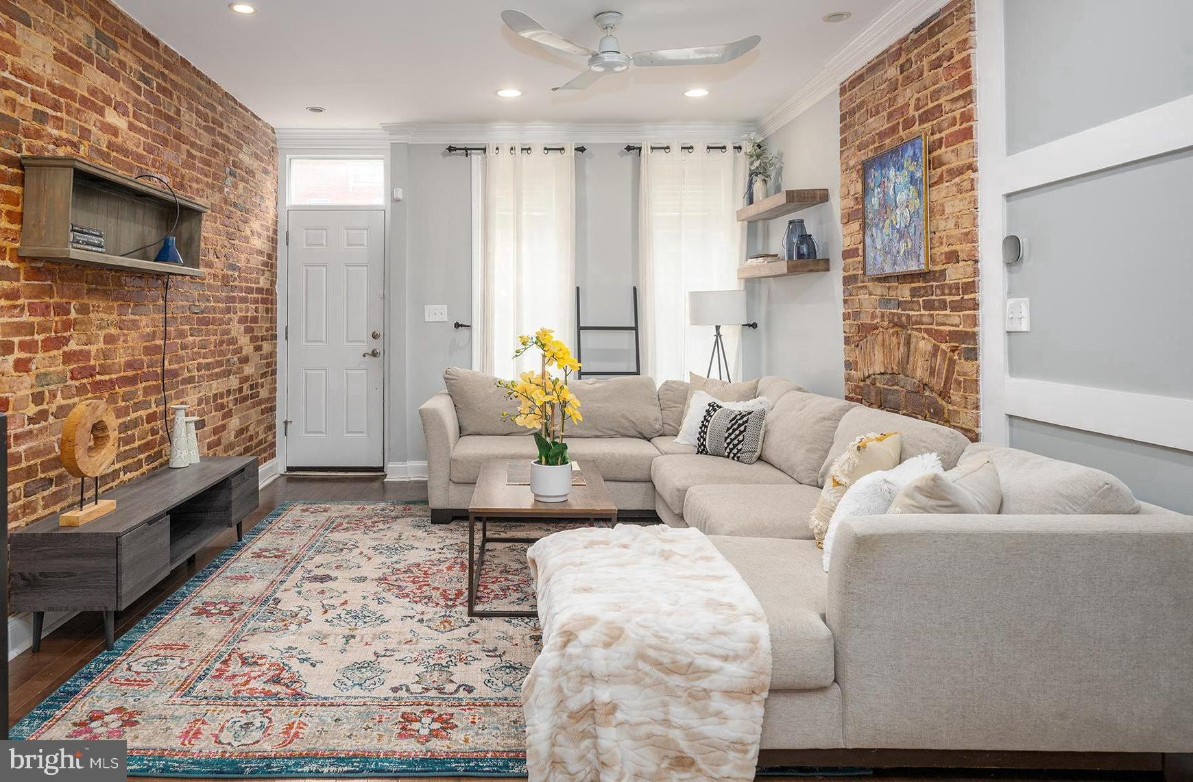Welcome to 1120 S East Ave, a spacious and airy home in a prime location just steps away from Canton Square. This beautifully updated residence is ready for its new owner.

The main level welcomes you with an open and inviting floor plan, featuring a spacious living room adorned with crown molding, exposed brick, decorative accent walls, and more, creating a charming and stylish atmosphere.

The dining room exudes elegance with its decorative fireplace, ideal for cozy gatherings. Step into the updated kitchen, complete with solid wood espresso cabinets, stainless steel appliances, and a large eat-in peninsula, offering plenty of storage and a perfect space for casual dining or entertaining.

Conveniently tucked away on the first floor, you'll find a half bathroom, adding to the practicality of the layout. Outside, a charming patio awaits, perfect for family cookouts and friendly gatherings.

Upstairs, the second floor boasts a large primary bedroom with vaulted ceilings and a spacious closet. The fully updated bathroom adjoining the primary bedroom provides a luxurious retreat. A second bedroom and a hallway bathroom complete the second floor, offering privacy and comfort for family or guests.

Recent upgrades include a new roof (2022), newer HVAC system, water heater, and more, ensuring peace of mind for years to come. Unfinished basement is great for storage.

Don't miss out on the opportunity to make this your new home in Canton, one of Baltimore's most sought-after neighborhoods. Schedule your private tour today and experience the perfect blend of tradition and innovation firsthand.