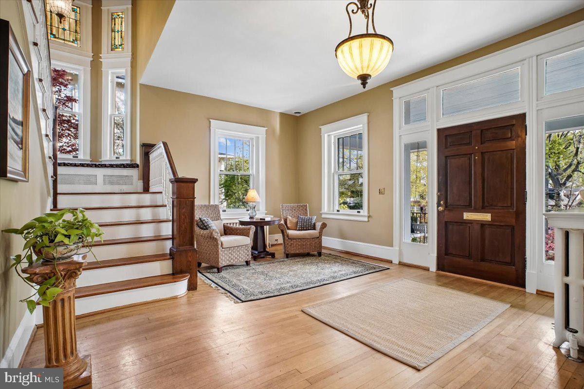 Some Homes Just Feel Different. This is One of Them. Now offered at $1,650,000!

310 North View Terrace is a historic Rosemont residence defined by exceptional ceiling height, timeless architectural detail, and a porch experience capturing remarkable sunrise views. The elevated approach enhances privacy and presence, creating a setting that feels both distinct and intentional.

For buyers seeking character, scale, and long-term value in one of Alexandria’s most established neighborhoods, this is a compelling opportunity.

This is a home that feels different the moment you walk in, and one that stays with you long after you leave.

A front porch, a swing, and an immediate sense of arrival. Homes of this caliber are seldom available. This fully reimagined 1918 Rosemont residence honors its architectural heritage while offering a level of detail and atmosphere that is simply hard to replicate. Inside, a light-filled foyer and sweeping staircase create a striking first impression, where original stained glass windows catch the morning light and add a layer of character you do not often find. Original 1918 hardwood floors, soaring ceilings, and abundant natural light carry throughout, creating an airy, refined atmosphere from room to room.

The living room offers a warm and inviting space to gather, complete with a charming window seat with built in storage and classic plantation shutters. A pocket door leads to the dining room, where a fireplace anchors the space and adds to the home’s timeless appeal.

Designed for both elegant entertaining and effortless daily living, the kitchen is both functional and inviting, featuring classic beadboard cabinetry, a large pantry, and a sunlit breakfast nook overlooking the garden, an ideal setting for everyday moments.

Outdoors, the experience continues with a beautifully curated backyard centered around a stone fireplace, offering a warm and inviting space for evenings under the stars or relaxed weekend gatherings.

Upstairs, four well-proportioned bedrooms provide flexibility, including a sophisticated primary suite with three closets and an updated bath designed for comfort and retreat. One of the secondary bedrooms features a charming adjoining space, likely once a sleeping porch, offering a unique and versatile extension of the room. 

The uppermost level offers exceptional versatility and privacy, ideal as an additional bedroom suite, home office, or family room. Complete with an en suite bathroom, walk-in closet, and custom built-ins, this space also includes an adjoining sitting room and captures a beautiful view of the top of George Washington Masonic National Memorial, adding a distinctive and memorable backdrop.

A spacious lower level offers exceptional scale with multiple areas for storage, making it easy to keep everything organized and out of sight. From both the first, second and third floors you can enjoy soft morning light and peaceful sunrise views, an understated luxury that defines the home’s ambiance.
Set in a quiet, tree-lined street neighborhood, 310 N. View Terrace offers a lifestyle where you feel connected and comfortably removed.

From here, everyday living feels easy. Morning coffee or an evening glass of wine at Grape and Bean, quick trips to Whole Foods Market, and the energy of Del Ray’s Mount Vernon Avenue are all just five blocks away. Old Town is just down the street, offering easy access to shops, dining, and the waterfront whenever the mood strikes. Nearby parks provide space to unwind, explore, and enjoy time outdoors.
For those who commute, convenience is unmatched. The King Street Old Town Metro Station is approximately an eight-minute commute from the home, with access to both the Blue and Yellow lines, and Alexandria Union Station offers Amtrak service with direct routes to NYC and more. I-395 access is moments away, making travel throughout the region seamless.