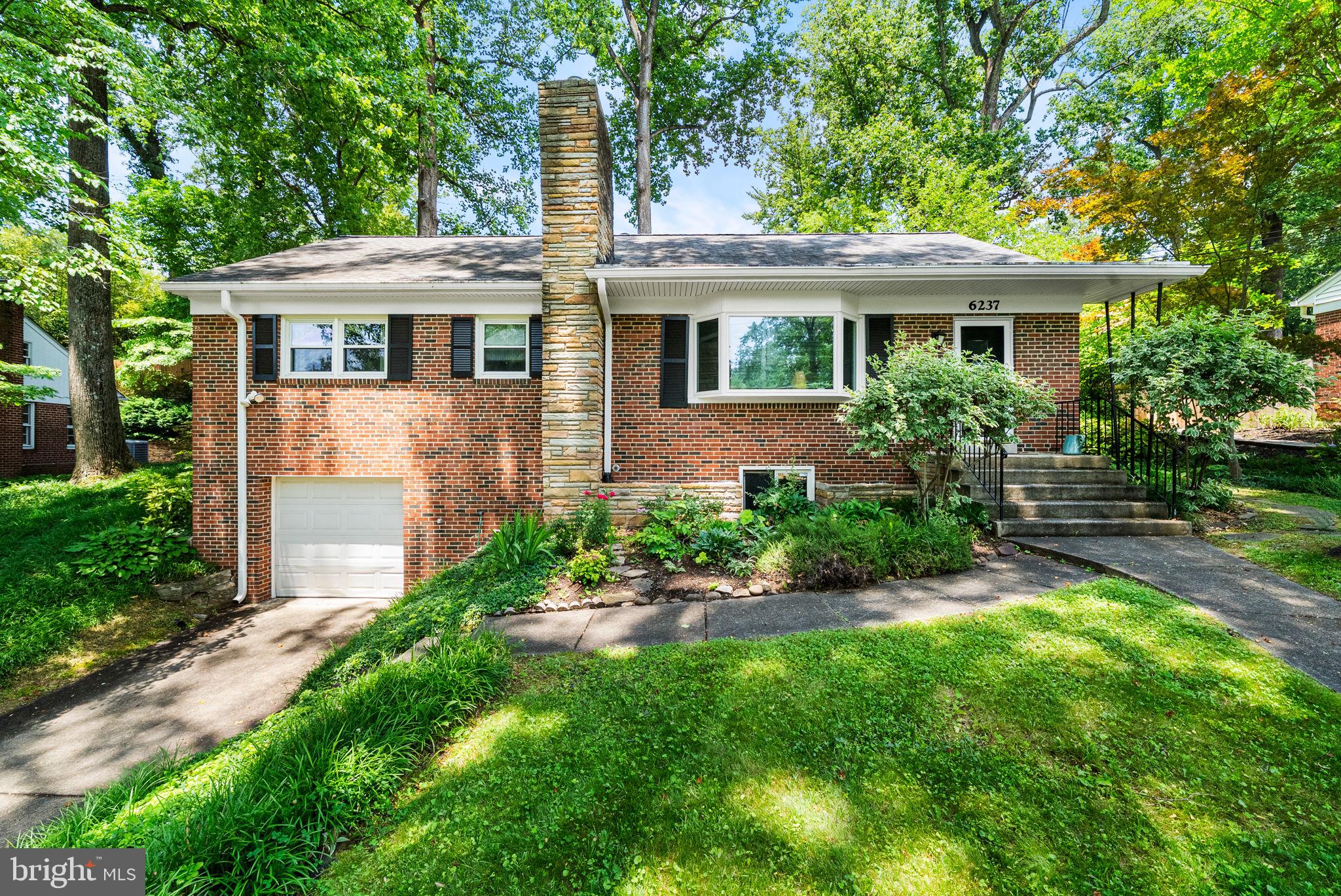 Welcome to 6237 Cheryl Drive in Falls Church — a beautifully maintained 4-bedroom, 3-bath home offering comfort, flexibility, and an exceptional outdoor retreat in a highly convenient location. Inside, the home features inviting living spaces highlighted by a warm gas fireplace, creating a cozy focal point in the main living area. The kitchen is equipped with stainless steel appliances and opens directly to the rear patio, allowing for seamless indoor-outdoor living and easy access to the backyard. Just off the kitchen, a versatile den offers the flexibility to serve as a potential additional bedroom, home office, or creative space, depending on your needs. The lower level expands the home’s versatility, featuring a wood-burning stove for added warmth and character, along with interior access to the garage for everyday convenience. A separate entrance enhances functionality, making this level ideal for guest accommodations, or a potential in-law suite. Additional flexible space can serve as a recreation area, home office, or bonus room. Step outside to discover the true showstopper, a stunning tiered backyard oasis. Thoughtfully designed with lush vegetation and striking stone retaining walls, the landscape creates multiple levels of usable outdoor space, perfect for entertaining, gardening, or quiet relaxation. Located in an established Falls Church neighborhood, the home offers excellent access to major commuter routes including I-66, Route 50, and I-495, as well as nearby shopping, dining, parks, and all the amenities of Northern Virginia living.