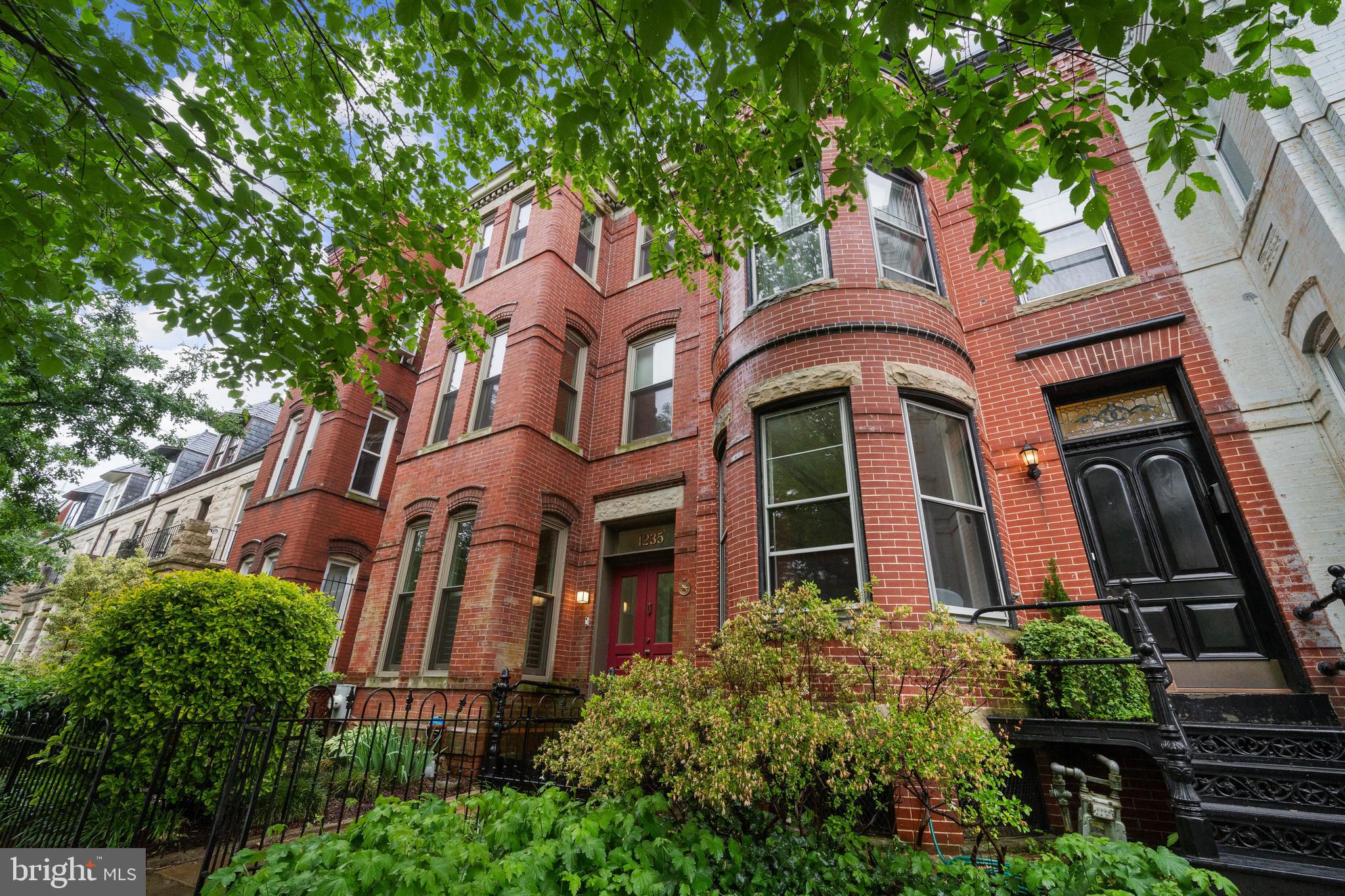 Charming Capitol Hill Victorian with Rare Detached Garage and Modern Updates. Nestled in the heart of the highly desirable Capitol Hill neighborhood, this quintessential D.C. Victorian row home offers over 2,000 square feet of refined living space across three levels, plus a rarely available detached garage. This elegant residence seamlessly blends timeless character with modern comfort—an ideal city retreat just steps from the historic charm and urban convenience that define Capitol Hill. Step inside to discover a spacious and light-filled floor plan designed for both everyday living and gracious entertaining. Signature features include tall windows, hardwood floors, crown molding, stained glass accents, and recessed lighting throughout. The grand living room, anchored by a decorative fireplace with a brick hearth, sets the tone for sophisticated gatherings. Adjacent, the dining room is equally suited for formal occasions or intimate family dinners. The gourmet kitchen is a dream for culinary enthusiasts, outfitted with granite countertops, gas cooking, upscale stainless appliances, and ample cabinetry. It opens to a sunny family room and flows effortlessly onto a private slate patio - perfect for al fresco dining or weekend relaxation. Additional main-level conveniences include a powder room, pantry area, and laundry room. Upstairs, the first upper level offers two spacious bedrooms and a well-appointed hall bathroom. The top level is a true owner’s retreat, featuring a sun-drenched primary suite with generous closet space and a private en-suite bath. Outside, the detached garage offers rare off-street parking in the city or can flexibly serve as a home office, gym, or studio. Just blocks from Lincoln Park, one of Capitol Hill’s most cherished green spaces, this home is surrounded by tree-lined streets, neighborhood cafés, historic architecture, and a strong sense of community. Enjoy easy access to Metro, Eastern Market and Barracks Row. This is Capitol Hill living at its finest—where historic charm meets modern convenience.