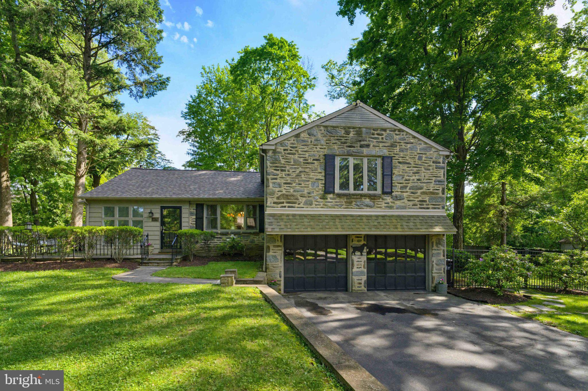 Welcome to 1070 Blue Rock Lane, a charming split-level residence set on a beautifully private .87-acre lot in the heart of Blue Bell. Nestled on a quiet, tree-lined street, this home offers a rare blend of space, comfort, and convenience in one of Montgomery County’s most desirable communities.

Step inside to a spacious, well-designed floor plan featuring three generously sized bedrooms and two-and-a-half baths. Sunlight fills the home, highlighting the hardwood floors and inviting living spaces throughout. The classic split-level design creates a comfortable flow, offering distinct yet connected spaces that are perfect for everyday living, entertaining, or simply relaxing at home.

Additional highlights include central air, an attached garage, and a layout that provides a wonderful foundation for personalization—move in and enjoy as-is or update over time to reflect your own style and vision.

Set within the highly regarded Wissahickon School District, this home is also ideally located near parks, shopping, dining, and major commuter routes, offering the perfect balance of privacy and accessibility.

A truly special opportunity to enjoy a spacious property, a prime location, and timeless potential—all in one exceptional Blue Bell address.