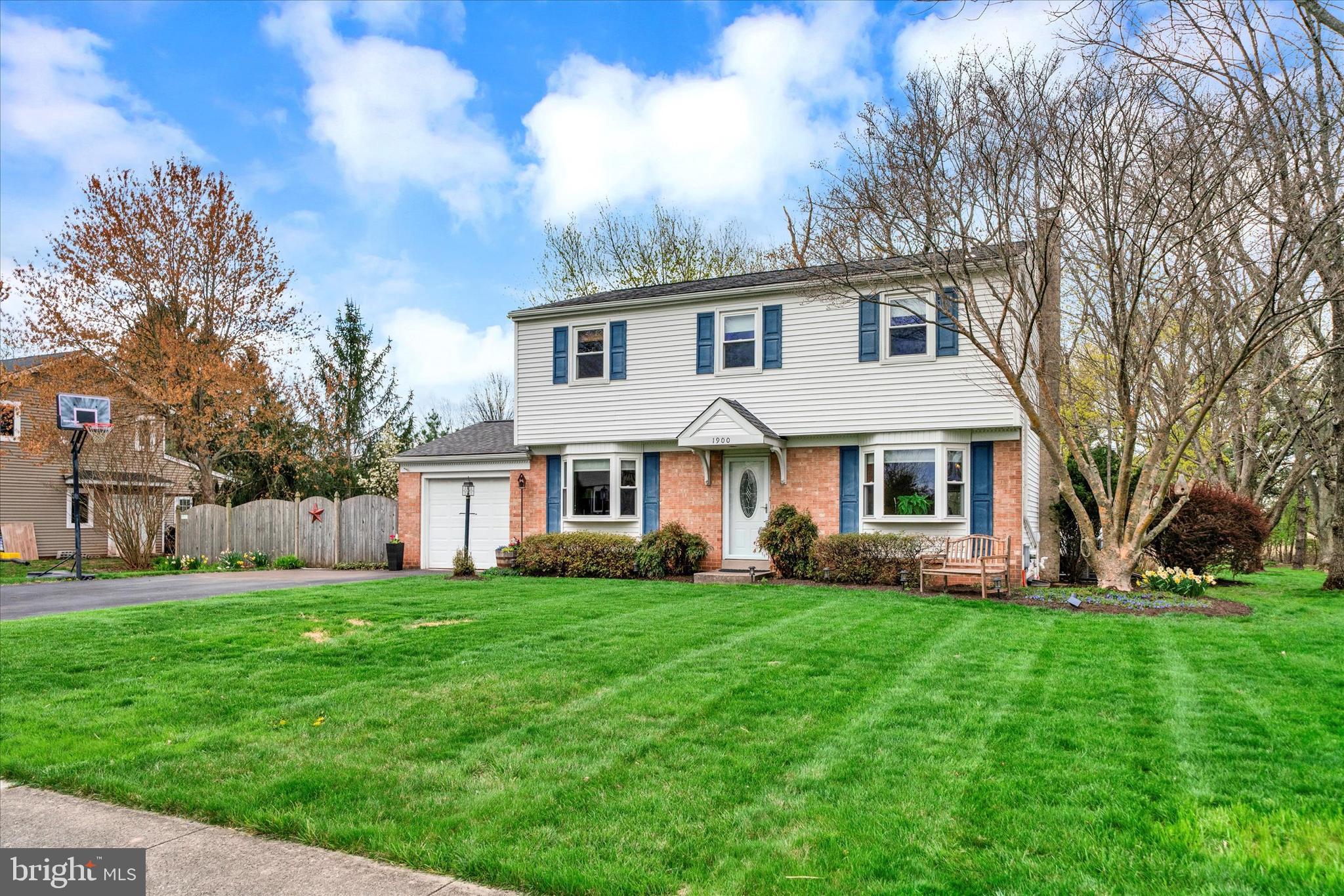 Searching for a move-in-ready home with unbeatable access to major routes? Your search ends here! On the market for the first time in over 30 years, 1900 Rampart Lane has been lovingly maintained and updated by its current owners, who are ready to move on to their next chapter. Set on one of the larger lots (0.85 acre) in the desirable Regent Manor community, this beautiful home offers versatile indoor and outdoor living spaces for year-round enjoyment.
As you step into the foyer, you'll notice the newer COREtec flooring which runs throughout the first floor. To your left is a bonus room (more on that later) and on your right is the formal living room. The living room features a large bay window, creating a bright, light-filled space. Continuing through the living room, a wide case opening leads you to the recently renovated kitchen (2022) with quartz countertops, wood cabinets with soft-close doors and drawers, and plentiful storage. The kitchen overlooks the stunning family room addition with cathedral ceiling, skylights, wooden beams and propane stove. A charming bay window frames picturesque views of the backyard, inviting natural beauty indoors year-round.
Back through the kitchen, proceed to the bonus room which, together with the powder room and laundry, encompasses the other side of the house. Formerly the original family room, this space, also with a bay window, is currently used as a sitting area and music room; the possibilities for this room are endless. The laundry room provides access to the yard and has a utility sink for quick clean-up after yardwork.
Upstairs, three nice-sized bedrooms share the hall bath (updated 2013) with dual vanity and storage niche with built-in hamper cabinet. The primary bedroom has 2 closets and an updated (2010) ensuite full bath. All four bedrooms have ceiling fans and there is a whole house fan. Additional storage space can be found in the attic with pull-down door.
The unfinished basement is currently used for storage and a workspace, but offers the potential to finish all or part for additional living space. Walk-up stairs provide access to the back yard.
Situated in the desirable North Penn School District, this home is conveniently located with access to major roads, shopping and transportation. Don't miss the opportunity to make this your next home - schedule your tour soon!