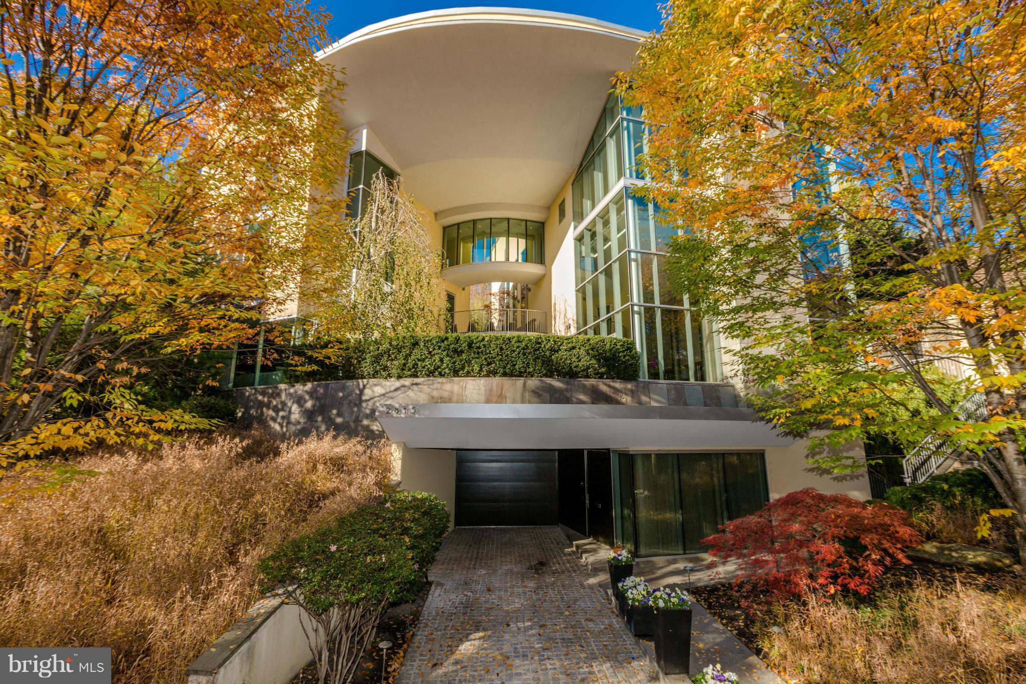A MUST SEE perfectly designed by Marshall Moya majestically overlooking Rock Creek Park. Custom built w/sweeping views from the 20 ft tall great room, owner's suite & all upper bedrooms. Slate floors, Savant whole house media system. 4 en suite bedrooms, 5 full baths, 5 fireplaces,  5 terraces, screening, wine and exercise rooms, sauna, saltwater infinity edge pool, guest suite, eight car garage, lush grounds, walk to METRO