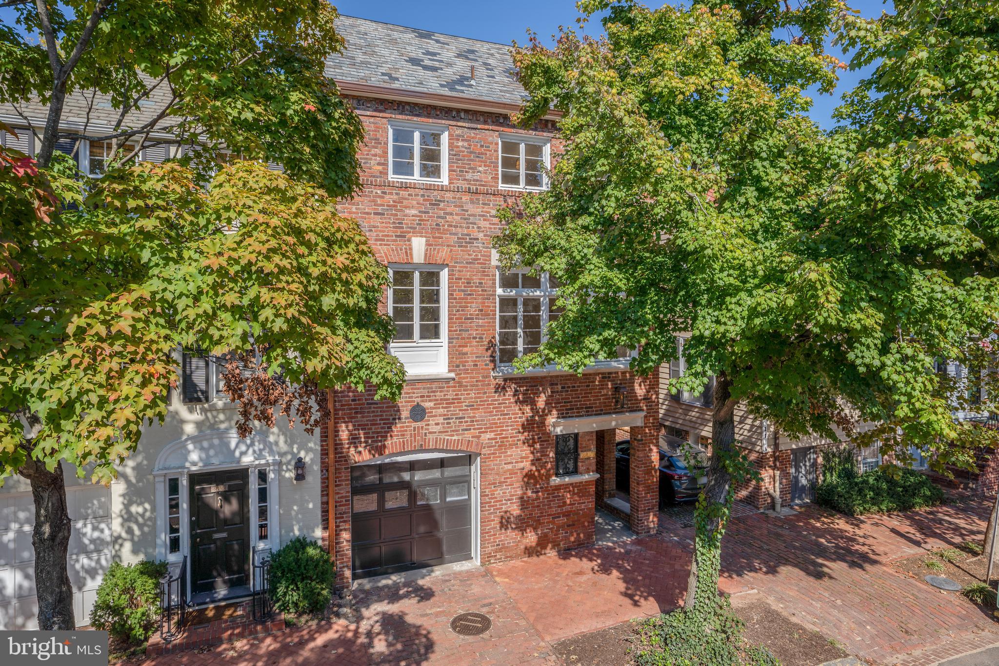 Top-to-bottom renovation completed in 2023 of this semi-detached, historic Georgetown home with garage parking and beautiful backyard! Originally built in 1905, this meticulously upgraded 4 Bedroom, 3 full Bathroom & 2 half Bathroom home seamlessly blends historic charm with modern amenities for the ultimate Georgetown living. Highlights include the grand foyer, quarter sawn White Oak Herringbone floors, bespoke stair rails, exquisite chef’s Kitchen with Christiana Kitchen cabinetry, La Corneau dual-fuel range and custom hood, Sub-Zero appliances and South-facing historically restored windows that flood the Dining Room and Kitchen with an abundance of natural light. Recent upgrades include but are not limited to: state of the art video surveillance system and audio package, high speed enterprise Wi-Fi with various access points throughout, 5 flatscreen smart TV’s, remote controlled window shades, heated flooring along the first floor/lower level, professionally landscaped yards with added landscape lighting and irrigation system. The Main Level is perfect for entertaining with a bright Living Room offering a gas fireplace, floor-to-ceiling French doors leading to a Bluestone patio, custom outdoor Kitchen and tiered, private, fenced-in lawn. The Primary Suite boasts coffered ceilings, walk-in closet by California Closets and en-suite Bathroom with a marble shower and dual-sink vanity. Additional features include the versatile Lower Level with its own Foyer, Mudroom and Garage access, in addition to a second Family Room with luxe wet bar, Powder Room, and au pair/guest suite.