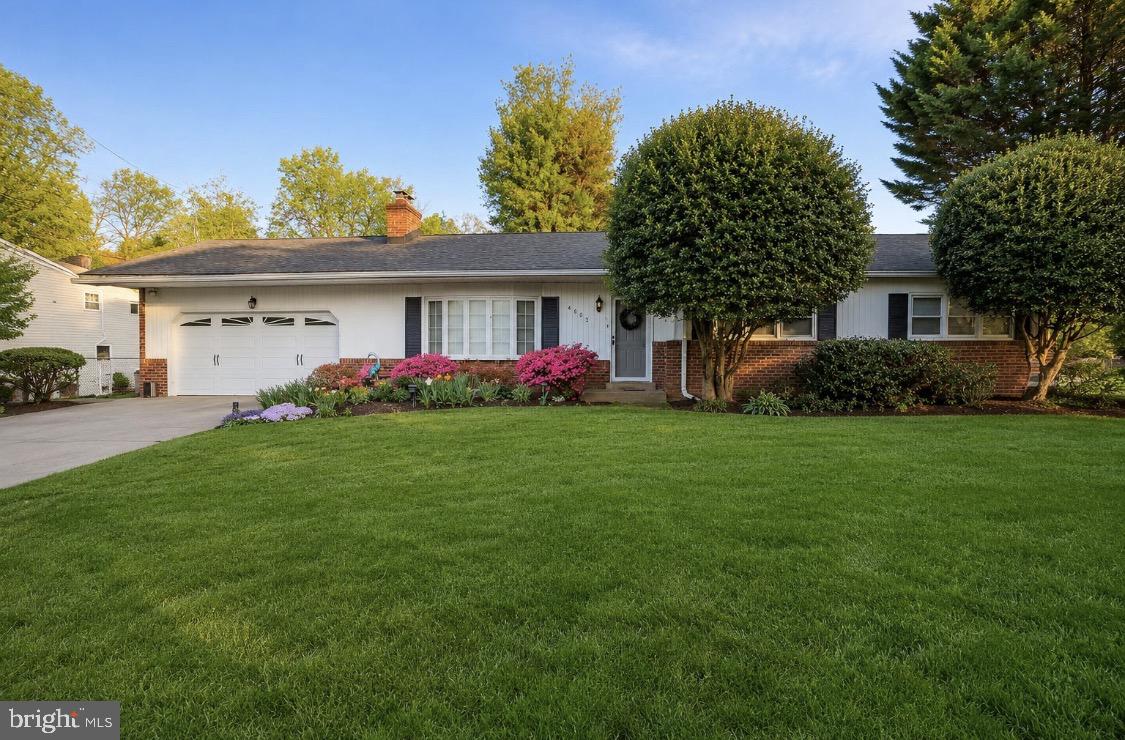 Beautifully maintained brick-front rancher with a surprisingly large footprint and numerous updates throughout. Freshly painted inside and out, this home features 4 bedrooms, 2. bathrooms, hardwood floors, an updated kitchen with granite countertops and stainless steel appliances, renovated bathrooms, and an open, functional layout. Two wood-burning fireplaces add warmth and character, including one on the main level and a second in the finished lower-level recreation room. The lower level also offers flexible living space, abundant storage, and a large unfinished area with endless possibilities. Outside, enjoy an expansive deck overlooking the private backyard, mature landscaping, and an oversized two-car garage. Conveniently located near shopping, dining, parks, and major commuter routes.