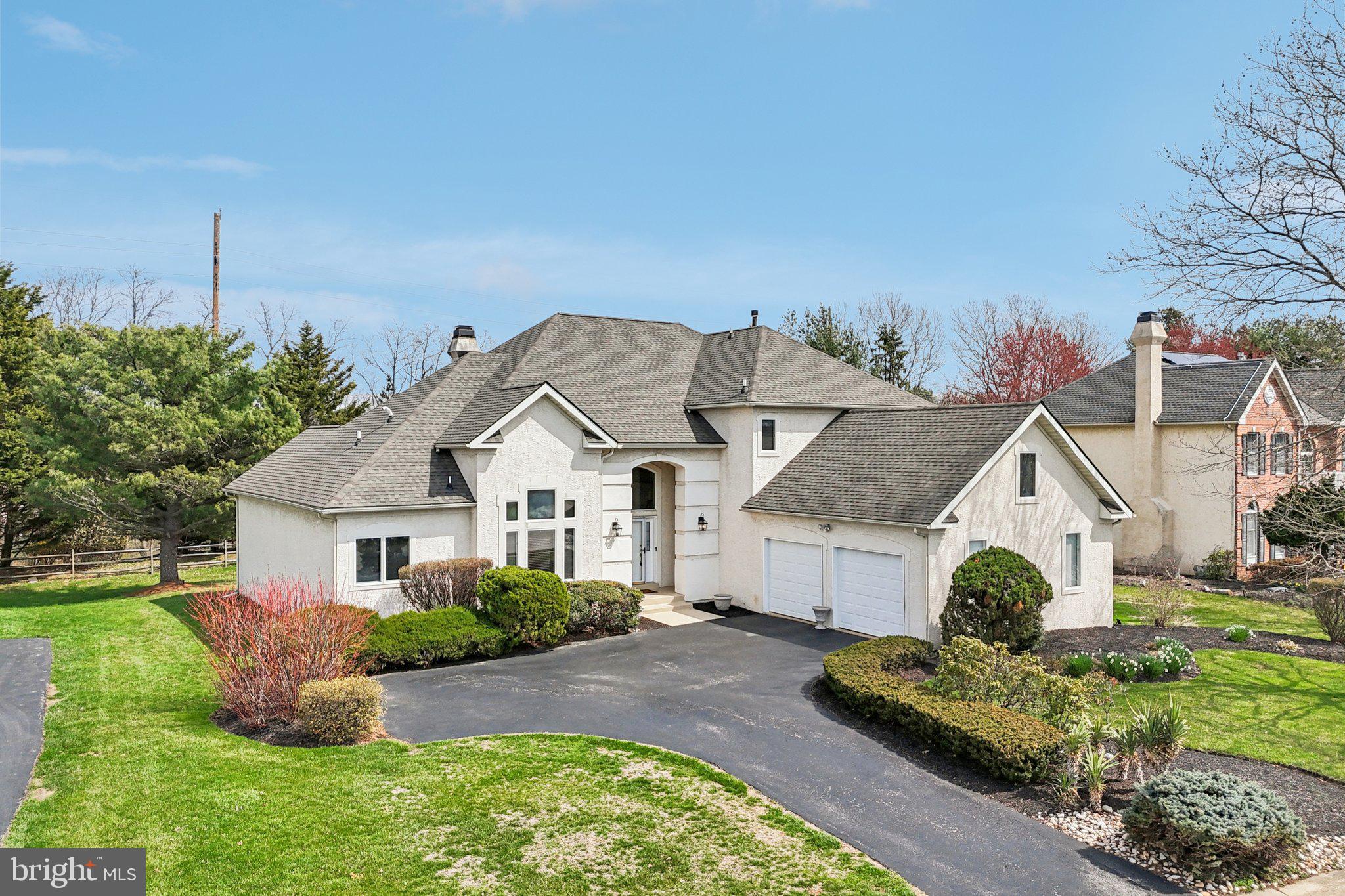 Bring your offer and enjoy the exceptional opportunity to live in the highly sought-after Greens at Waynesborough community in Berwyn at an outstanding value. Welcome to 663 Augusta Court. This thoughtfully designed home offers the convenience of a first-floor primary suite and private office, while two additional bedrooms for family or guests are located on the second level. The home sits on approximately 0.36 acres on an elevated lot with a private backyard in a quiet cul-de-sac setting. Recent upgrades include newly installed Brazilian Cherry hardwood flooring throughout the living room, dining room, family room, and hallway leading to the primary suite, newly installed granite countertops, a roof replaced in 2017, and a 2024 high-end dishwasher. Families will also appreciate access to the highly rated Tredyffrin-Easttown School District, with multiple school bus stops conveniently located throughout the community. As you enter, you’re welcomed by a bright two-story foyer with a distinctive chandelier. The great room features soaring ceilings, abundant natural light, crown molding, and a specially designed wood-burning fireplace, creating a warm and inviting gathering space. The spacious dining room continues with crown molding and a chandelier, making it ideal for entertaining. The eat-in kitchen includes an island with bar seating and a stainless steel refrigerator that is still under extended warranty. Just beyond, the adjacent living room features a vaulted ceiling and access to the newly painted rear deck, creating a seamless indoor-outdoor connection. The deck overlooks the private backyard and a unique self-planting vegetable garden with mature, nutrient-rich soil. The primary suite offers a spacious walk-in closet with built-in shelving. The en-suite bathroom includes vaulted ceilings, a double-sink vanity, a jetted tub, and a glass walk-in shower. A private office with double doors is conveniently located adjacent to the primary suite and could also function as a nursery or sitting room. The laundry room with washer and dryer is also conveniently located on the main level. Upstairs, the two bedrooms, loft area, and staircase feature newly reinstalled carpeting. A full hall bathroom includes tile flooring, a double-sink vanity, and a tub and shower combination. The lower level offers a spacious family room with carpet flooring, perfect for a media room, playroom, or additional living space, along with ample unfinished storage space. Conveniently located near Waynesborough Country Club, local shopping, grocery stores, restaurants, and more, this home offers both comfort and convenience. Don’t miss the opportunity to make 663 Augusta Court your new home.