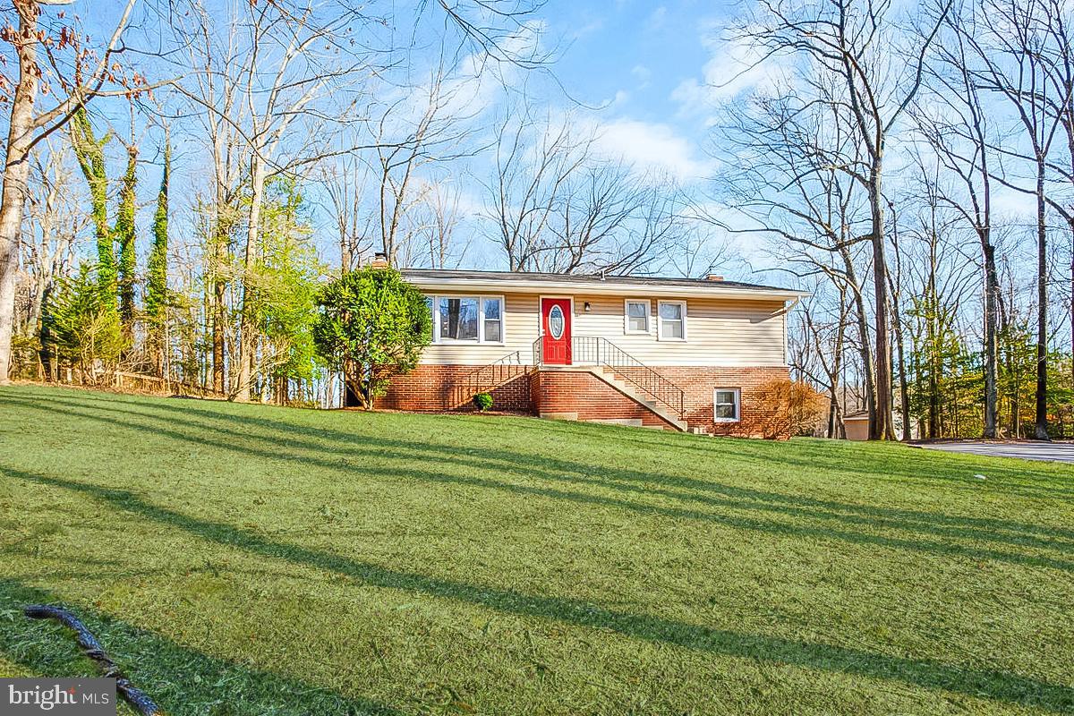 Private Retreat with a Country Feel – Just Minutes from Everything! Tucked away on 4.5 serene acres, this beautifully remodeled, move-in-ready home offers the perfect blend of peaceful living and prime convenience. Home was completely updated in 2019 with new kitchen and bathrooms, new appliances, new HVAC, new hot water, all new fixtures and lighting.  Primary bedroom and bath plus 2 more bedrooms and a full bath on main level.  Walkout level basement with huge family room, bonus room & full bath, plus storage/laundry area and a separate storage room tucked out of sight. Pellet stove provides warmth all winter.  The oversized detached two-car garage features its own electric panel, making it an ideal workshop, while the expansive driveway accommodates up to 10 vehicles. Need more storage? A large shed provides plenty of space for all your extras.  Located right across from Crofton High School, this unique property is just moments from shopping, dining, and major commuter routes to DC, Baltimore, and Ft. Meade. A truly rare find!  Roof, all appliances and HVAC replaced in 2019.  Well rehabbed in 2020 with a new well pump and 2022 with a new well line.