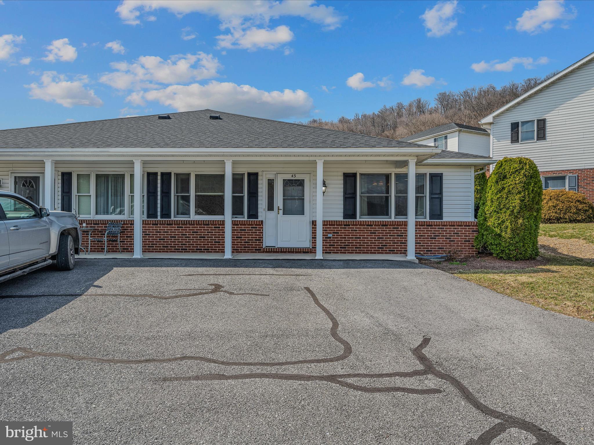 Carefree Retirement Home - If you're 55 or older and seeking a relaxed, low-maintenance life this home presents this outstanding opportunity. This inviting home features 2 bedrooms, 2 bathrooms, kitchen-dining area with appliances, living room, and laundry closet. Designed for accessibility, the single-level floor plan incorporates wide hallways and spacious door openings. Additional advantages include electric baseboard heat, public water, and sewer. Enjoy the convenience of nearby grocery stores, medical offices, pharmacies, and downtown Berkeley Springs.