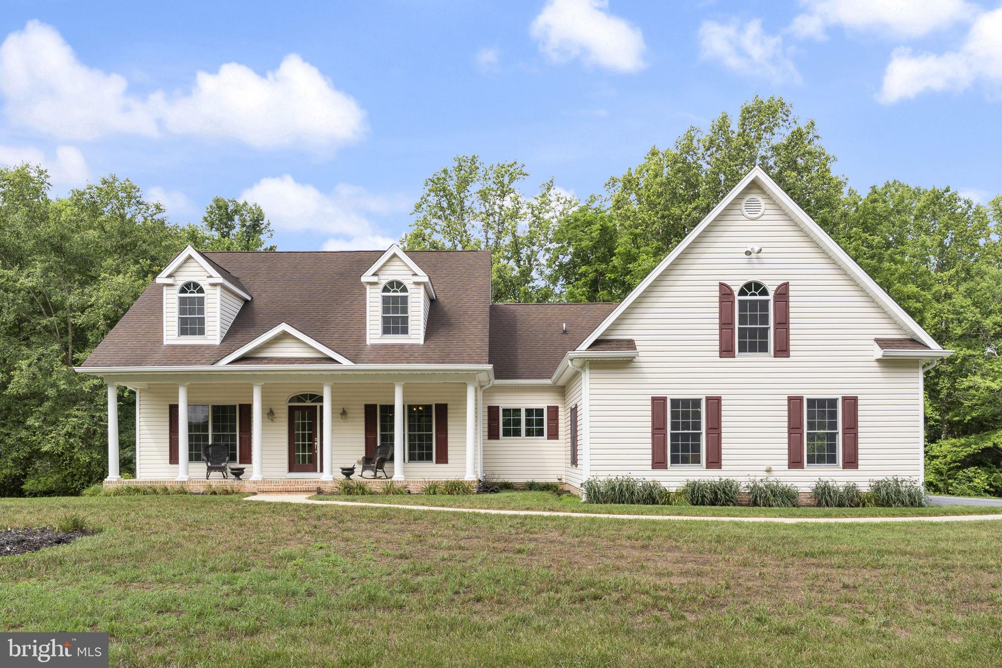 Welcome to 6312 Mill Branch Road, an IMMACULATE peaceful Huntingtown retreat tucked away on a beautiful, private setting. This property offers the space, privacy, and flexibility that are so hard to find, while still being located in sought-after northern Calvert County. 
Inside, the home features a bright and functional main-level layout with hardwood flooring, neutral paint, and comfortable gathering spaces.  Enjoy an open floor plan and soaring ceilings with the family room open to the breakfast area and kitchen.  The family room also has doors leading to the screened back porch.  Speaking of the kitchen, you will fall in love with the warm granite counters, tall cabinets, ss appliances and breakfast bar.  The formal dining room gives even more entertaining or flex space.  Main level primary suite is a true get away and features door to deck and screened porch, walk in closet with built in organizers, soaking claw foot tub, separate shower, double sink vanity and water closet.   On the other side of the home you will find two additional bedrooms and another full bath.  Don't miss the bonus fourth bedroom over the garage!  Laundry and mud room lead to oversized attached garage.  All you need is on one level here, but the lower level offers endless possibilities to give double the square footage as you make it your own.  
Outdoor living is a true highlight, with  the front porch, screened back porch, rear covered patio, all surrounded by wooded acreage. The setting offers room to garden, play, entertain, store vehicles and toys, or simply enjoy a more private country lifestyle. The home is served by some of the best Calvert County Public Schools and gives owners an easy commute to Annapolis, Washington DC and Baltimore.  Truly something for everyone here.