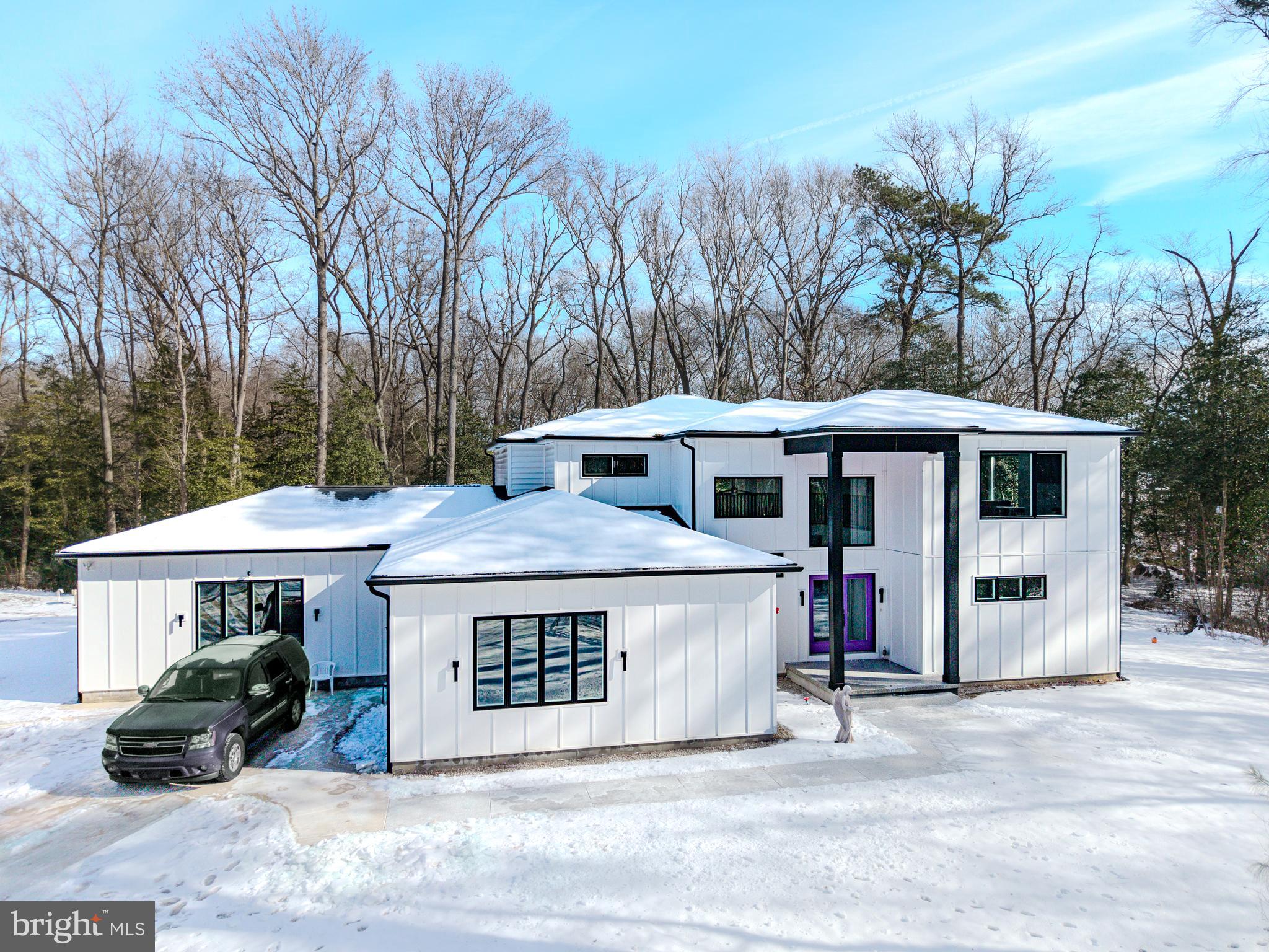 A rare coastal Delaware opportunity offering unmatched space, privacy, and future potential.

The listed price reflects the main residence situated on approximately 6.2 private acres. Two additional adjacent parcels are available and may be purchased together with the home or sold separately, offering flexibility for buyers, builders, or investors. Combined, the three parcels total nearly 12 acres.

The two additional parcels have been approved by the county for two residential homesites on each, creating a prime opportunity for future development, a family compound, or investment. Whether you envision a private retreat or long-term value, this property delivers all just under 10 miles to the beach and approximately 4 miles to everyday shopping and conveniences.

Step inside through dramatic double doors into a stunning, light-filled great room with soaring ceilings that seamlessly connects to the kitchen and dining area, perfect for both everyday living and entertaining. The chef’s kitchen is designed to impress, featuring a massive island, double full-size refrigerators, double wall ovens, and an oversized walk-in pantry.

The main level offers flexible living spaces ideal for a home office, library, guest quarters, or additional bonus rooms tailored to your lifestyle. Upstairs, you’ll find spacious bedrooms, a full bath with a walk-in shower, and loft-style living areas connected by open walkways that enhance the home’s modern architectural design. The primary suite serves as a true private retreat, offering tranquil wooded views and a spa-inspired bathroom featuring a soaking tub, expansive walk-in shower, dual vanity, and a generous walk-in closet/dressing area.

Outside, enjoy your own private nature preserve with a peaceful creek, paver seating area, and abundant wildlife, offering tranquility and privacy rarely found this close to the coast.

A truly one-of-a-kind coastal property that must be experienced in person.
