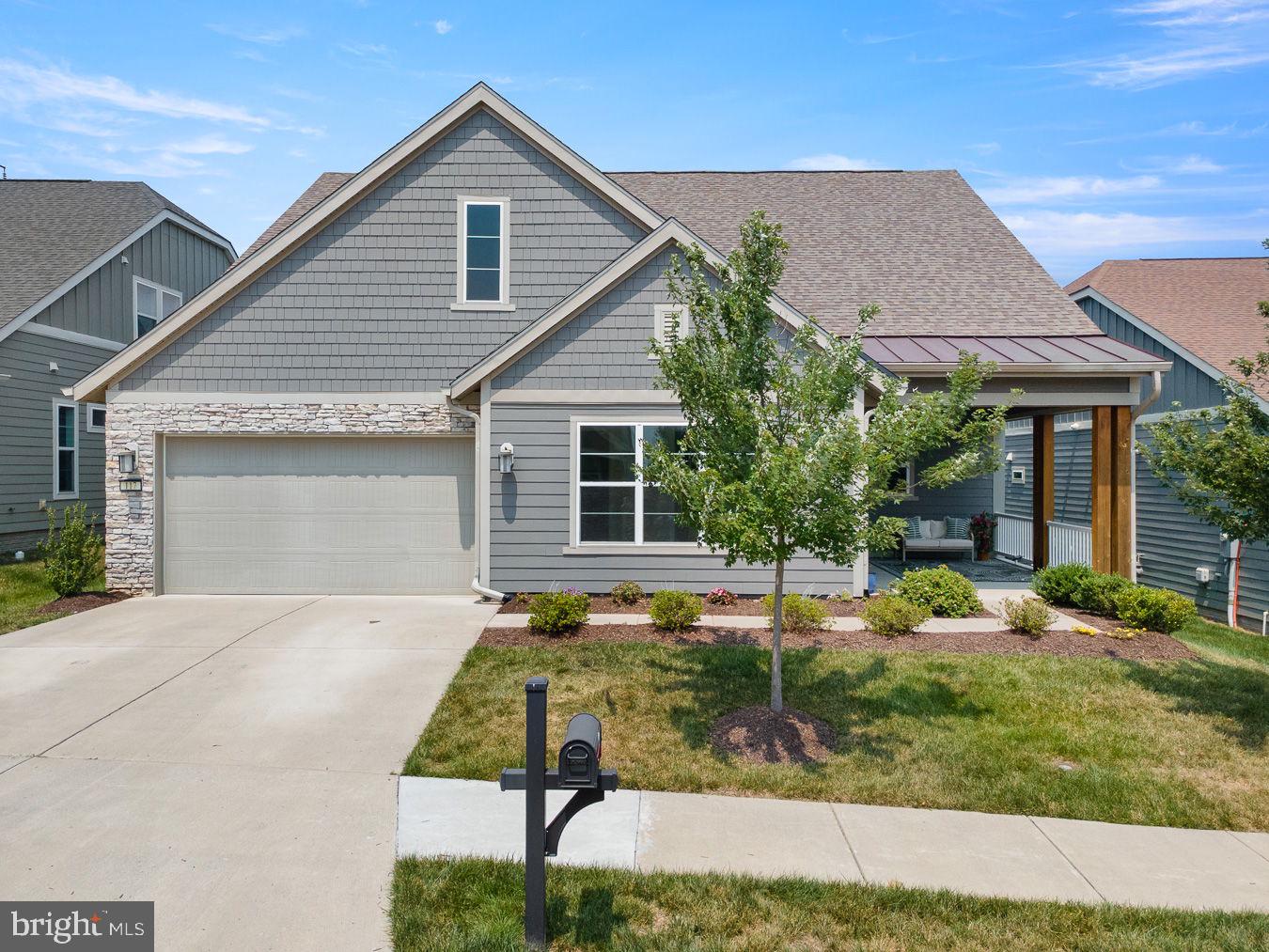 FREEDOM, WELLNESS & CONNECTION in Trilogy at Lake Frederick. “Take a look and you will get hooked,” with this exceptional Ascend model by Shea Builders. Thoughtfully designed for main-level living, nestled on a premium lot, on a peaceful street filled with caring neighbors' and a serene backdrop of protected parklands that offer plenty of privacy. Built in 2020, this stunning barely lived in residence offers an expansive open concept abode, luxurious comfort and breathtaking views. Featuring 3 spacious bedrooms, 3 bathrooms, and 1 powder room, over 3600 finished square feet, on one and a half levels of living. Showcasing more than $300,000+ in builder upgrades, this home is a must see! “Just one look and you will be hooked.” This extraordinary home offers a rare opportunity to enjoy new construction without the wait, the decisions, or the expense of starting from scratch. The distinctiveness is apparent the moment you walk through the door. The home blends timeless architecture with contemporary modern updates. A dramatic 10-foot foyer with a warm organic green hue that fosters a natural connectedness to nature and the greenery outdoors. Rich warm hand-scraped hardwood floors extend across the entire main level, and a custom Empire Chandelier with crystal leaves add to the sensational drama. It boasts a large flex area, that can be used as a living room, a dining room, an office, or a game/playroom. It can be used for sophisticated entertaining or good ole fashioned family fun. The great room has a cozy keeping room with a fireplace made for snuggling up with a good book or a night cap before retiring.The gourmet kitchen is packed with all the modern conveniences; it’s a chef’s dream with Shea’s upgraded package the Signature Kitchen series. Modern granite countertops, a neutral tile backsplash and stacked cabinetry pair seamlessly with high-end stainless-steel appliances including a massive island with seating and tons of useful storage. An eat in dining space sits adjacent to the kitchen and it opens up to a spacious great room ideal for everyday living and entertaining. The adjacent morning/sunroom is the perfect place to relax, enjoy a quiet morning coffee or unwind at the end of the day, with direct access to the rear porch and large stamped concrete patio, it creates a smooth indoor-outdoor living experience, which makes outdoor cooking and alfresco dining a treat. The main-level primary suite offers a tranquil retreat with embossed art deco wallpaper, an oversized closet with custom built-in drawers and shelving, and a spa-inspired bath featuring a glass shower and a grand soaking tub with a groovy modern chandelier above. The expansive laundry room is a true standout, equipped with abundant cabinetry, folding counters, and hanging space to keep everything in its identified place. Upstairs, a large recreation room creates a versatile space for family relaxation, recreation, crafting or media. It boasts Graham and Brown gold embossed geometric wallpaper, a third bedroom with a large walk-in closet and a full bathroom complete this level making it ideal for multigenerational living or cozy guest quarters. Added thoughtful upgrades include gutter guards, a beautifully landscaped lot with colorful flowers, blown in insulation, whole-house water filtration, irrigation, premium garage door and a tankless water heater. This is a rare opportunity to own a meticulously upgraded, nearly new home where every improvement has already been made and every detail is ready to enjoy. Offering a seamless blend of elegance, comfort, and accessibility, this magnificent home is an exceptional prospect for discerning buyers seeking refined living in a peaceful and private setting. Experience the pinnacle of resort living at Trilogy in Lake Frederick where your dream home and ideal lifestyle come together seamlessly.
