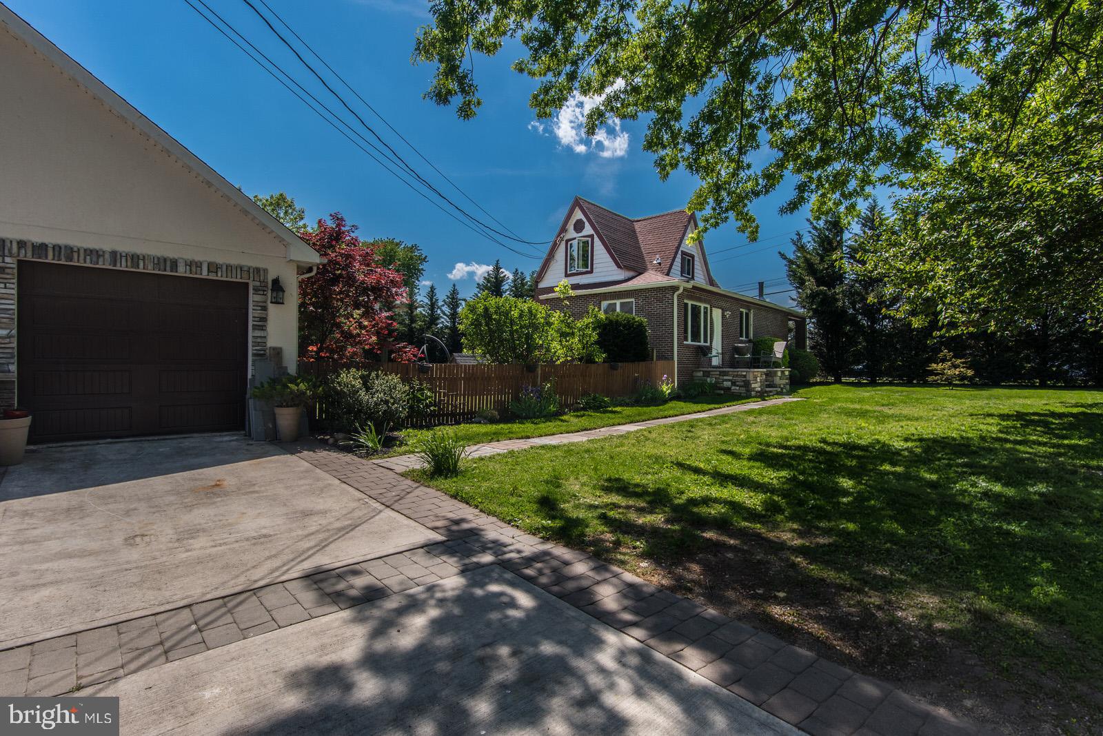 Seller has made a significant price adjustment !!! Located on the desirable Delaware River side of Radcliffe Street, this charming brick Cape Cod offers the kind of location that rarely becomes available. Just steps from the river, the home enjoys lovely water views from the kitchen and side yards, creating a peaceful setting with all the character and charm buyers are searching for.

Situated on a spacious corner lot of nearly half an acre, this beautifully updated home features a welcoming covered front porch stretching across the front of the property, perfect for relaxing and enjoying the surroundings. Inside, you’ll find stunning diagonal hardwood flooring, a large living room with an oversized gas fireplace, and rich dark wood trim and molding throughout, adding warmth and timeless character to the home.

The sun-filled kitchen was thoughtfully renovated with a center island, granite countertops, custom soft-close cabinetry, tile backsplash, stainless steel appliances, and an adjoining dining area with access to the rear deck — ideal for entertaining or enjoying warm summer evenings outdoors.

The first floor offers a spacious primary bedroom, separate office or flex space, and an updated powder room with laundry connections. Upstairs, you’ll find two generously sized bedrooms, including one with river views, along with a beautifully remodeled full bath featuring a custom mosaic tile shower.

An unfinished basement provides excellent storage space. The property also features a huge detached garage, perfect for car enthusiasts, contractors, hobbyists, additional storage, or anyone needing substantial workspace.

Conveniently located just minutes from Bristol Borough’s charming waterfront downtown filled with restaurants, coffee shops, and local shopping, while also offering easy access to I-95, the PA Turnpike, and nearby commuter routes.

A truly special property offering charm, character, beautiful updates, river views, and an unbeatable Bristol location.  HOME QUALIFIES FOR REDUCED INTEREST RATE & NO PMI with low downpayment.