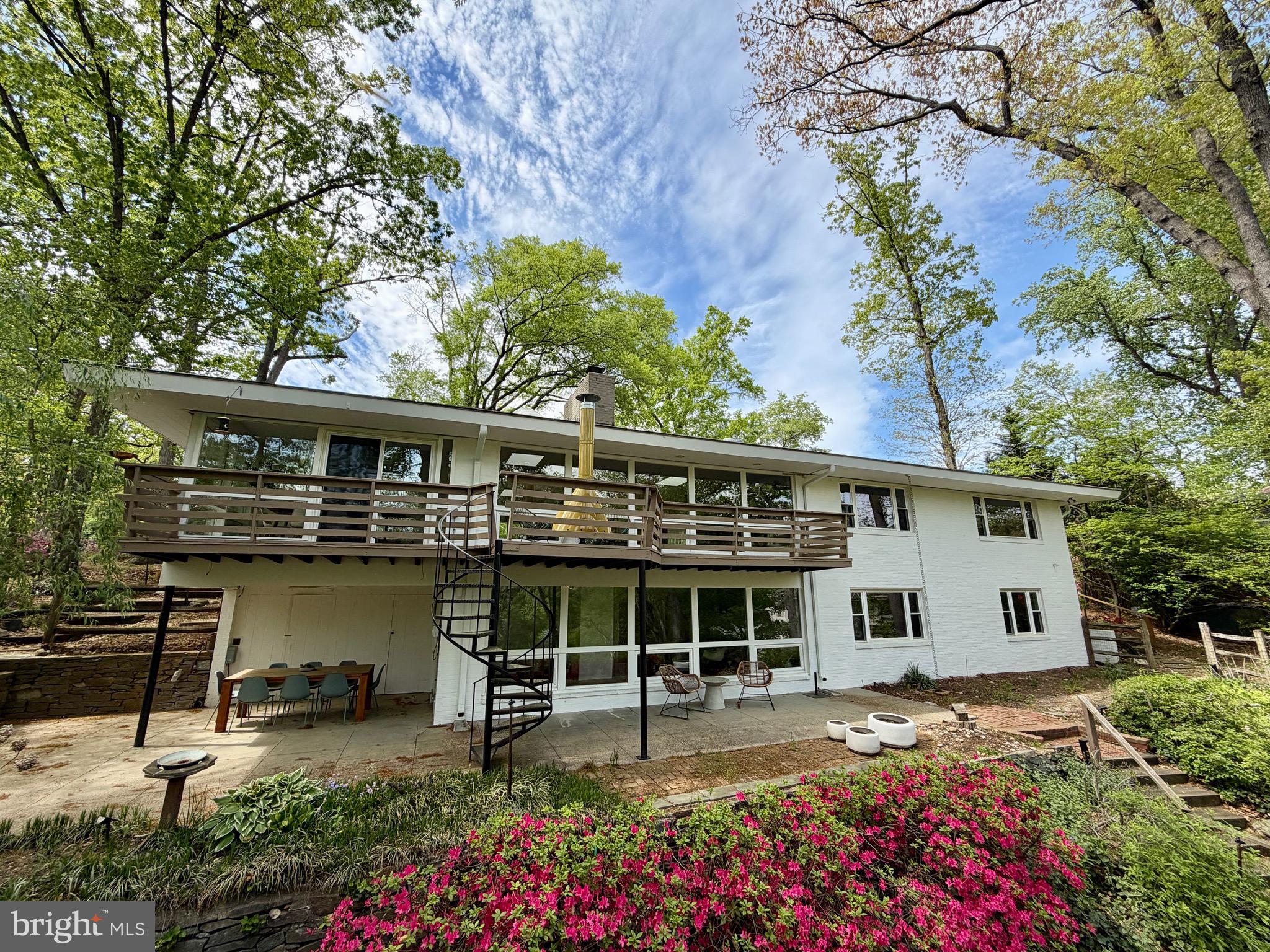 Extensively renovated in 2024–2025, this exceptional private waterfront residence in the sought-after Lake Barcroft community offers breathtaking water views.  Thoughtfully reimagined for modern living, yet has kept the Mid-Century Modern charm, the home features four bedrooms and four fully remodeled bathrooms. A redesigned floor plan enhances flow and functionality. Two level home with main level living! The main level showcases a luxurious primary suite complete with a custom walk-in closet and spa-inspired en-suite bath featuring a double vanity, walk-in shower, and towel warmer. Throughout the home, you’ll find new 7.5-inch wide European white oak engineered flooring with radiant heat beneath most of the floors, as well as a full-house radiant heating system with individual room controls. The stunning new kitchen is outfitted with Bosch appliances, a Forno refrigerator, quartz marble countertops and backsplash, a peninsula with seating and storage, and a cooktop with wall-mounted pot filler, all enhanced by a large new window above the sink.  Don't miss the hidden door from kitchen to oversized one car garage!  

Additional upgrades include new recessed lighting, baseboards, interior and exterior doors with Emtek hardware, a tankless gas water heater, updated electrical components, built-in closet systems in all bedrooms, and fresh interior and exterior paint. Both wood-burning fireplaces—located on the upper and lower levels—feature new Heath Ceramics tile and are plumed for gas conversion. 

The exterior is equally impressive, featuring multiple outdoor spaces designed for entertaining to include private front courtyard, deck across rear of home with beautiful views and spiral staircase down to lower level patio. Extensive landscaping and hardscaping designed to enhance natural light and maximize lake views. The fenced-in yard has been thoughtfully cleared and improved, with a newly added fire pit area by the water—perfect for relaxing evenings and waiting for your boat along your private waterfront.

Located within the established Lake Barcroft community in Falls Church, Virginia, this home offers access to a unique wooded setting and five private resident-only beaches. Known for its welcoming atmosphere, the neighborhood hosts a variety of social events throughout the year, including the beloved Fourth of July fireworks over the lake, making this a truly special place to call home.