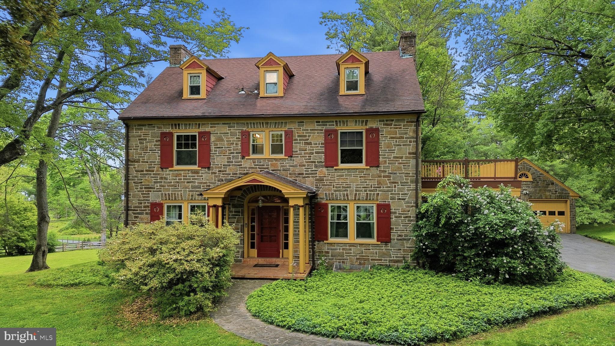 Timeless Chadds Ford estate filled with charm, character, and endless possibilities, set on over two picturesque acres in one of the Brandywine Valley’s most prestigious locations. Ideally situated just minutes from the Delaware state line along historic Kennett Pike, this exceptional  classic Chester County stone house offers 5 bedrooms, 4 full bathrooms, and 1 half bath across approximately 2,904 square feet of thoughtfully designed living space.
The main level features a gracious and inviting layout, highlighted by a formal living room with a walnut-lined wall and classic wood-burning fireplace, an elegant formal dining room, and a sunlit breakfast room with skylights that fill the space with natural light. An enclosed porch provides the perfect setting for year-round relaxation while overlooking the property’s serene surroundings.
The second level offers three spacious bedrooms and two full bathrooms, including a private primary suite and walk-in closet. The third floor adds two additional bedrooms and another full bath, creating ideal accommodations for guests, extended family, home offices, or flexible lifestyle needs.  All three levels feature hardwood floors and cedar-lined closets.
The finished basement, thoughtfully renovated in 2002, expands the home’s living and entertaining space and features a tile floor, bar area, a wall of built-in bookcases, a gas fireplace, large tool room, full bath, and a utility room for added convenience.
Outside, the beauty and privacy of the expansive grounds create a true countryside retreat with an aesthetic mix of mature trees and flowering bushes.  A detached two-car stone garage, long private driveway with a stone entranceway, and ample parking complete the property’s exceptional functionality.
Additional improvements include conversion to city water in 2000, while the original well house with electric service remains in place. The property is serviced by dual septic tanks, maintained annually.
Rich in local history, this remarkable setting lies within an area once traveled by British troops during the Battle of Brandywine, adding a meaningful connection to one of Pennsylvania’s most significant Revolutionary War landmarks.
Located in the heart of  Chadds Ford, this home is surrounded by the timeless beauty and cultural richness of the Brandywine Valley. Renowned for its rolling hills, historic estates, celebrated wineries, Longwood Gardens, and the legacy of the Wyeth family, Chadds Ford offers an unmatched blend of art, history, and countryside elegance.
A rare opportunity to own a distinctive property in sought-after Unionville-Chadds Ford school district — where classic Pennsylvania charm, rich heritage, and modern-day convenience come together in one extraordinary offering.