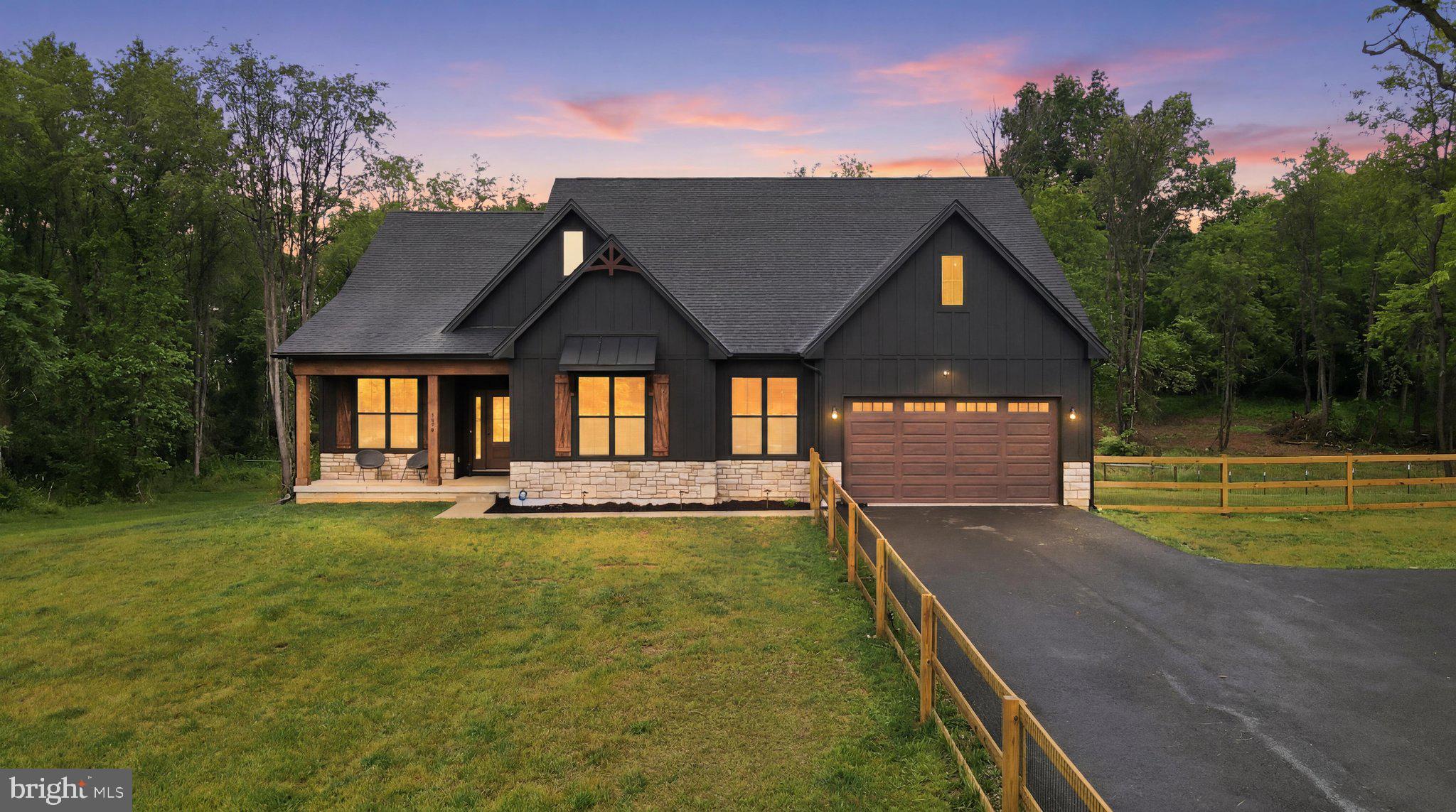 This stunning farmhouse-style residence, built in 2025, offers a perfect blend of modern comfort and timeless craftsmanship. Nestled on a generous 3.55-acre lot adorned with mature trees, this home invites you to experience tranquility and natural beauty. Step inside to discover an open floor plan that seamlessly connects the living, dining, and kitchen areas, creating an inviting atmosphere for gatherings. The heart of the home features gleaming stainless steel appliances, soft close cabinets and quartz counter tops, perfect for culinary enthusiasts, while a spacious pantry provides ample storage. The cozy gas fireplace serves as a focal point in the living area, adding warmth and charm. With four well-appointed bedrooms, including three main level bedrooms, this home is designed for both relaxation and functionality. The primary suite boasts a luxurious bath and a walk-in closet space, ensuring a private retreat. Thoughtful interior features like luxury vinyl plank flooring, ceiling fans and a 96,000 grain water filtration system with an anodized rod enhance quality and convenience. Working from home is a breeze with a dedicated office that offers plenty of natural sunlight and great views of the sunset. The full basement offers endless possibilities for customization, whether you envision a recreation room, home gym, or additional storage. Energy efficiency is addressed with a high quality insulation package (R49 attic, R19 walls, R13 basement and air seal around home) and dual pane tilt windows. Outside, the expansive lot provides a serene backdrop for outdoor activities, including an acre of fencing around the property.  Additionally the attached front-entry garage, equipped with an EV car charger, and paved driveway offer practical parking solutions. This exceptional property combines unique architectural elements with modern amenities, making it a true sanctuary to call home. Experience the perfect balance of elegance and comfort in this remarkable residence. The best part is, there is no HOA. Schedule your tour today to see this spectacular home.