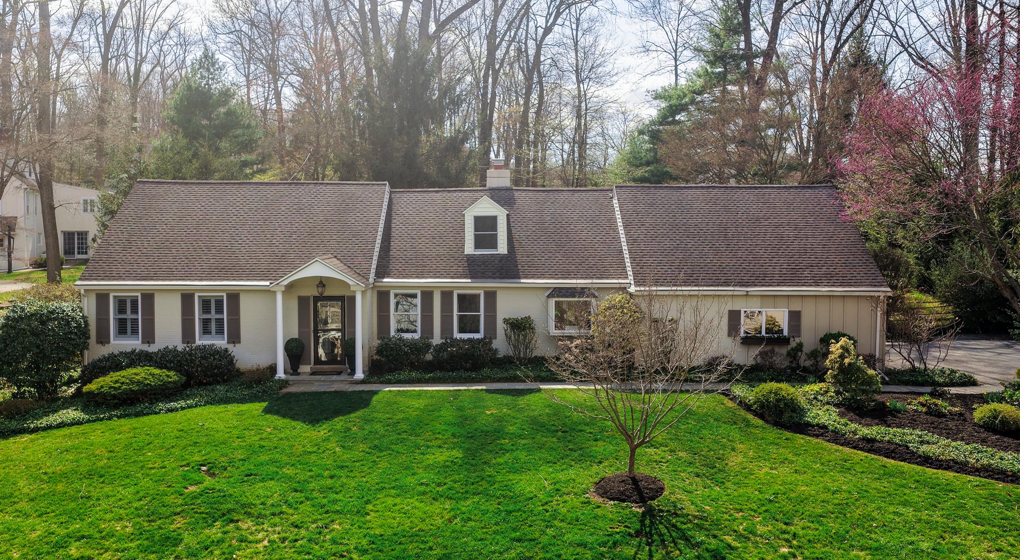 **Seller has set an Offer Deadline of 2:00, Sunday, April 19, 2026** Located in Devon’s highly sought-after Shand Tract, 650 Timber Lane is a charming and thoughtfully expanded Cape Cod offering 4 Bedrooms and 3.5 Baths. This move-in-ready home seamlessly blends classic character with tasteful updates, all within a neighborhood celebrated for its vibrant social atmosphere and strong sense of community.
A welcoming Foyer accented by crown molding and wainscoting opens to rich hardwood floors that extend throughout the home. The formal Dining Room features custom built-ins, while the spacious Living Room with a gas fireplace flows into a beautiful family room highlighted by vaulted ceilings, skylights, and expansive windows overlooking the backyard. Just beyond, a flagstone Patio invites relaxed indoor-outdoor living.
The updated Kitchen offers granite countertops, a center island, custom off-white cabinetry, and a cozy breakfast area complete with a fireplace and bay window. The first-floor Primary Suite, appealing to a range of lifestyles, features a beautifully updated ensuite Bath with a walk-in shower, porcelain tile flooring, a double-sink vanity with polished black quartz countertops, and recessed lighting. Across the hall, a private Office provides flexible use and can easily serve as a fifth bedroom. A Powder Room, Laundry/Mudroom, and direct access to the garage complete the main level.
The second floor offers three additional spacious Bedrooms, all equipped with ceiling fans, along with a Full Hall Bathroom, a cedar closet, and attic storage accessed through the second bedroom.
The partially finished lower level provides wonderful recreation space with painted floors and walls and a drop ceiling with lighting. Generous in size, the area comfortably accommodates a sectional sofa, seating, a pool table, and more. A full Bathroom and multiple storage rooms add exceptional functionality, while a basement door leads outside via steps to the backyard.
Additional highlights include radiant heated floors, fresh paint throughout, and timeless plantation shutters.
Outdoors, the property continues to shine with a flagstone patio, large fenced rear yard perfect for activities, a dedicated lawn shed, and an attached side-entry two-car garage.
Ideally located within the top-ranked Tredyffrin���Easttown School District, and just minutes from downtown Wayne, Gateway Shopping Center, Whole Foods, Wegmans, the Devon Horse Show, and SEPTA Regional Rail, this home offers outstanding convenience for shopping, dining, and commuting.
** Please note  - Seller does not believe that the Square Footage number in the Public Record reflects the All Seaons Room. Buyer to verify.