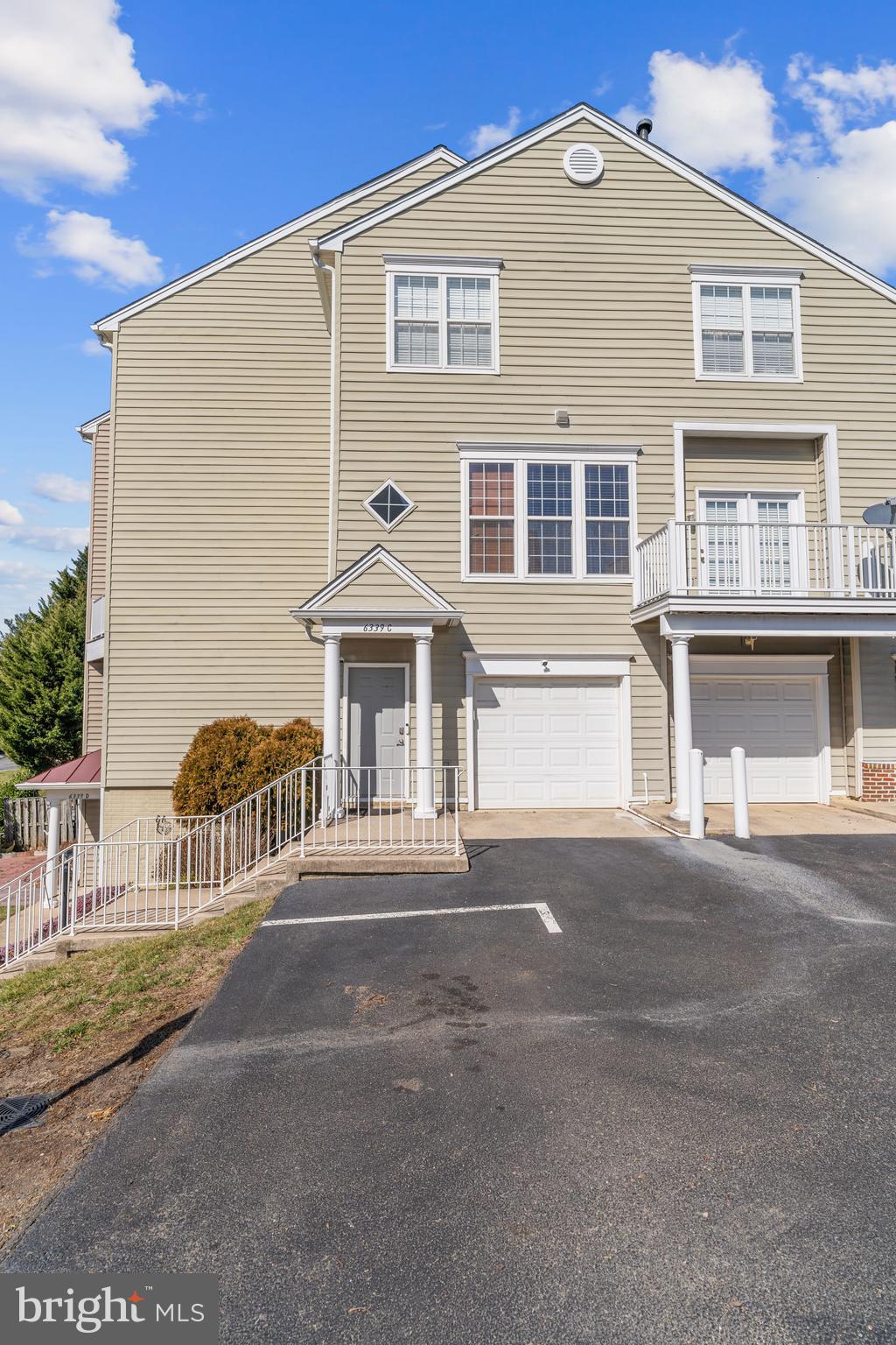 Indulge in the luxurious comfort of this meticulously designed TH-style condo boasting 2 bedrooms, 2 full & 1 half bathrooms, an attached 1-car garage, and 1730 sq.ft. of refined living space. Nestled within the esteemed Overlook community in Alexandria, this residence offers an unparalleled blend of sophistication tranquility & an onsite pool! 

A striking feature of this home is the breathtaking panoramic views of lush greenery, meticulously landscaped surroundings, and captivating sunset skies, a rare gem for condo-style living within the Beltway.

Step through the front entrance, sheltered under a charming portico, or effortlessly park in the adjacent garage. Enter to discover a welcoming tiled foyer adorned with a sleek brushed nickel pendant candelabra.

The Main Level unfolds with an inviting open floor plan, accentuated by an oversized slider door and two banks of three windows, flooding the space with natural light and offering picturesque vistas of the verdant landscape along Timber Forest Drive.

The heart of the home resides on this level, featuring a spacious Living Room with access to the composite deck through the expansive slider door. Adjacent is the separate Dining Room, bathed in natural light from double windows.

The gourmet kitchen exudes elegance with granite counters, stainless appliances, custom floor tile, and a generously sized bar height counter, perfect for casual dining or observing the culinary artistry at work. An adjoining entertaining area showcases a cozy gas fireplace and double windows that bathe the space in sunlight.

Completing the Main Level is a thoughtfully upgraded half bath, offering convenience and style.

Retreat to the Main Bedroom, a haven of relaxation boasting a tray ceiling, triple window, and a large walk-in closet. The accompanying Main Bathroom is a spa-like sanctuary, featuring a separate shower and tub, upgraded fixtures, framed mirrors, and custom floor tile.

The second bedroom is equally inviting, offering ample space for a Queen bed, an en suite bathroom, and a double door closet. This bathroom also boasts upgraded fixtures for added luxury.

Convenience meets functionality on the bedroom level, where the laundry is discreetly tucked away in a walk-in closet, along with the HVAC and water heater.

No detail has been overlooked in this exquisite abode, with vinyl-clad, double-hung windows adorned with custom pull-up/pull-down blinds, a custom Andersen slider door, and upgraded light fixtures throughout, including LED recessed lights with adjustable color levels to suit personal preferences.

Enhancing the aesthetic appeal, all door hardware has been upgraded to brushed nickel, exuding an air of sophistication.

The HVAC system, a Carrier unit installed in June 2020, ensures year-round comfort and efficiency.

Outside, an unreserved parking space awaits just steps from the front door, while ample visitor parking is conveniently located nearby.

For leisure and recreation, the community pool is a mere three-minute walk from the front door, providing the perfect retreat for relaxation and socializing.

Experience the epitome of refined living in this exceptional condo, where every detail has been meticulously crafted to provide a sanctuary of elegance and comfort.