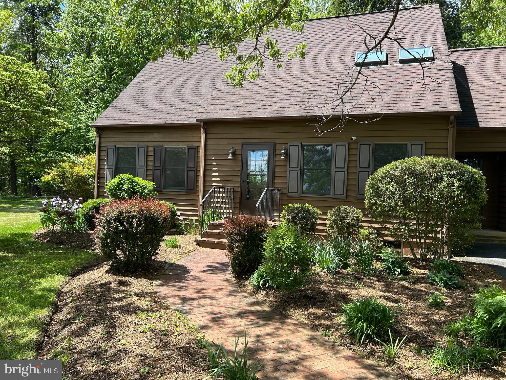 Welcome home to 359 Malvern Drive. This lovely home in the Malvern of Madison community offers the serenity of a four-acre, mostly wooded, private lot, yet in a vibrant community with many amenities. Very accessible to Madison and US Highway 29, the house boasts valuable main floor living with primary bed and bathroom on the main level. A spacious galley kitchen, traditional living and dining rooms and combo laundry  and mud room makes everything you need for living easily accessible on the main floor. A beautiful and light-filled sunroom on the back of the house leads to a modern deck for outside living. The upper level includes three large bedrooms and a full bath. The unfinished basement offers a walk-up exit and is ready for adding additional living area. A large, well-landscaped yard for outdoor living lies adjacent to nearly three acres of wooded privacy, a perfect home for both privacy and community. Sale is subject to county approval of pending septic drainfield easement. Septic drainfield for this property lies within the confines of the three-acre lot next door which is also for sale.