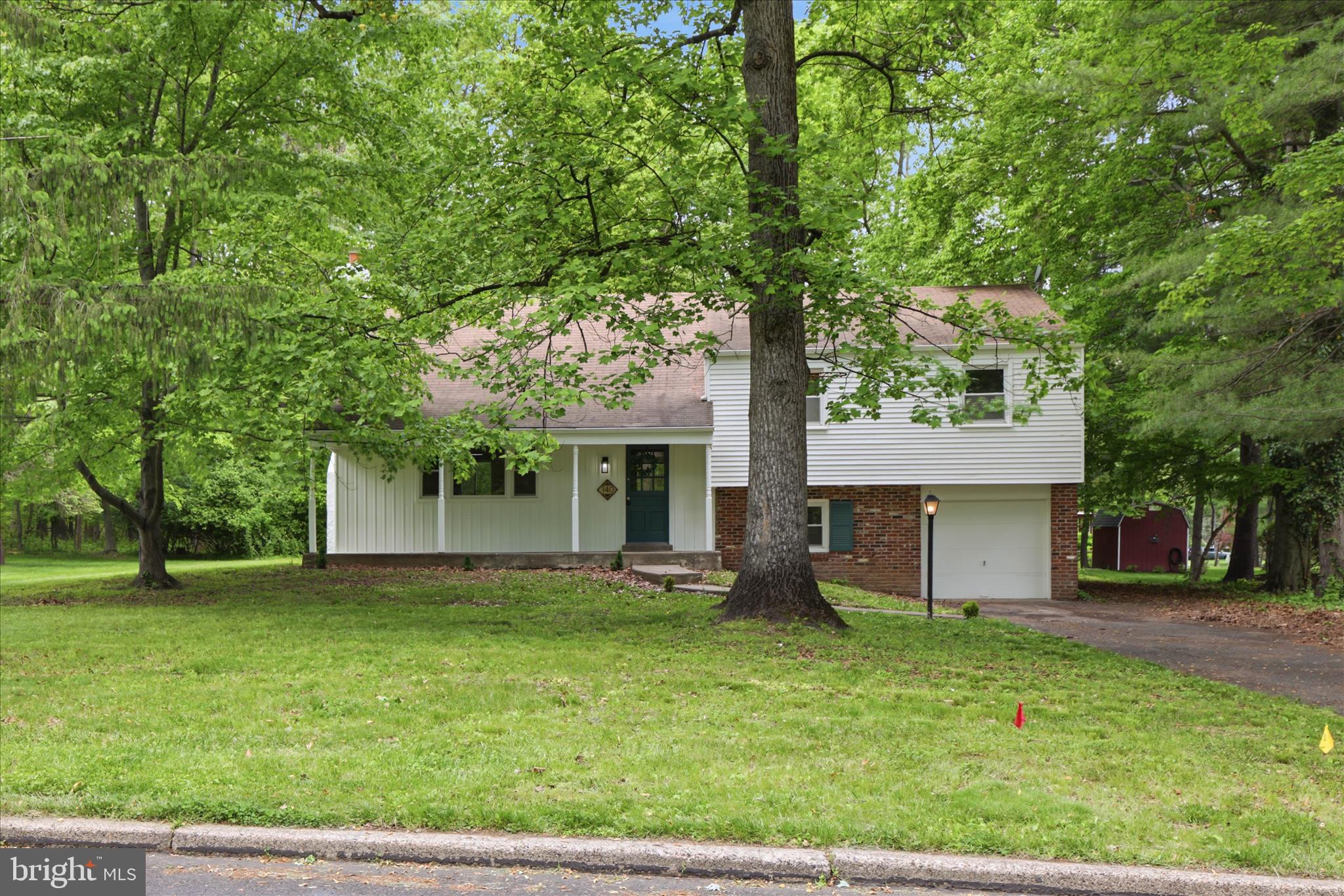 Tucked into a quiet, tree-lined street in Montgomery Township, this fully remodeled 5-bedroom sits on just under a half acre of wooded property — the kind of lot that makes the street live up to its name. Inside, hardwood floors run throughout, with thoughtful accents that give the home warmth without trying too hard. The primary bedroom is genuinely large — not "spacious" in the listing-copy sense, but actually room to breathe. Out back, the deck looks out over mature trees and the kind of green privacy that's getting harder to find in this part of Montgomery County. Location is the quiet superpower here. You're in the North Penn School District (Bridle Path Elementary, Pennbrook Middle, North Penn High), five minutes from the Montgomeryville shopping corridor, and a short drive to the Lansdale SEPTA station for a direct line into Center City. Route 309, the PA Turnpike, and 202 are all easy reaches. Downtown Lansdale — Round Guys Brewing, the Saturday farmers' market, and a growing restaurant scene — is just down the road.
Move-in ready, in a neighborhood people don't tend to leave. Schedule your showing today!
