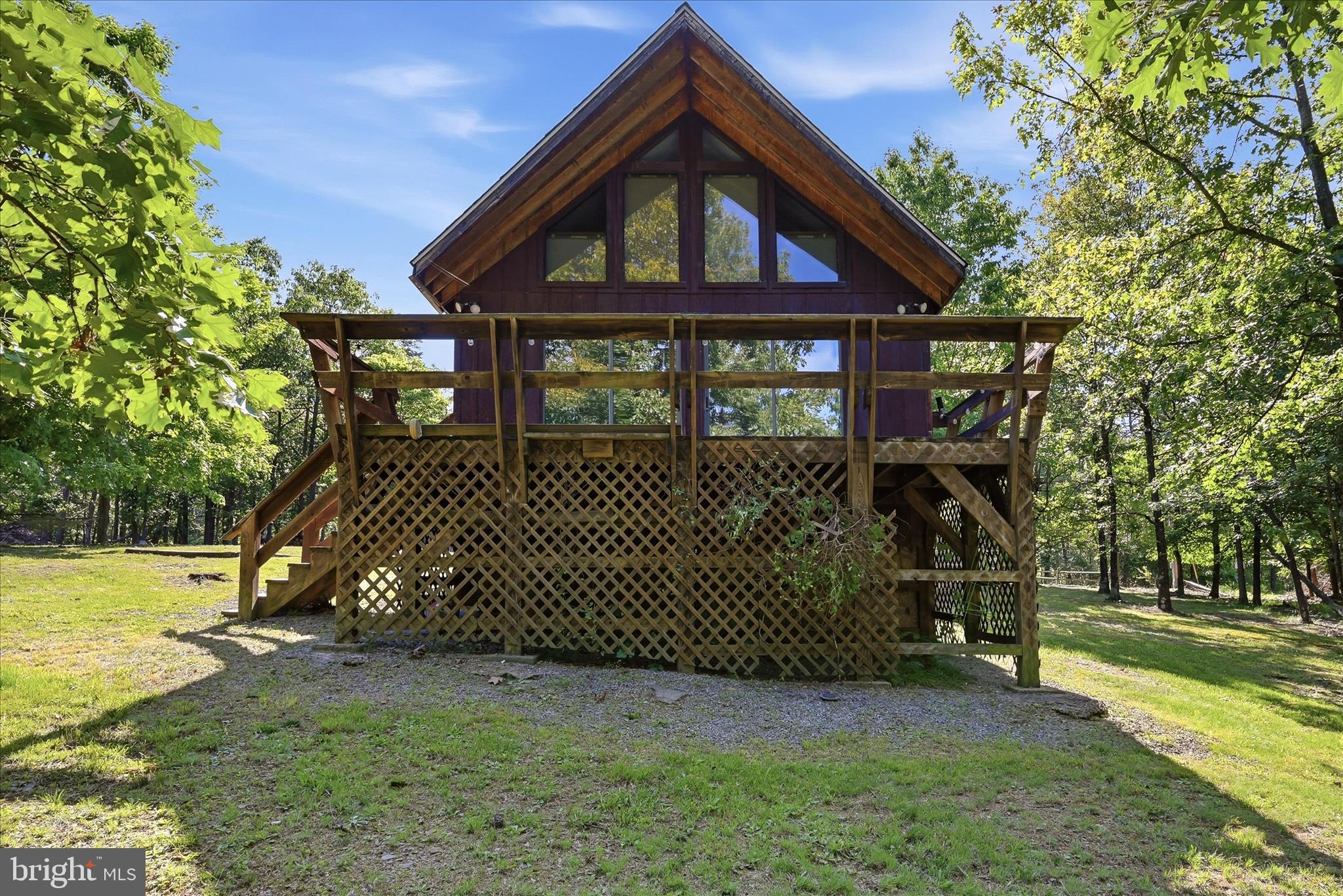 Escape to the mountains with this charming 2-bedroom, 1-bath home on over 3 acres with breathtaking views. Whether you're looking for a full-time residence, weekend getaway, or short-term rental opportunity, this property offers the perfect blend of comfort and outdoor living.
Enjoy stunning sunsets and mountain views from the deck, relax by the cozy wood stove, and embrace the peace and quiet that make this property the perfect escape from the hustle and bustle of everyday life. Step inside and you'll be greeted by lots of natural light, fresh paint throughout, and an updated kitchen featuring new cabinets and countertops.
A detached garage provides additional storage, workshop space, or room for recreational equipment. Recent improvements include a new roof and electrical updates in 2018, plumbing updates in 2023, and a new water filtration system installed in 2026.
Conveniently located just 10 minutes from Cacapon State Park and only 30 minutes from Winchester, VA, you'll enjoy easy access to hiking, golf, fishing, dining, and everyday amenities while still feeling miles away from it all.