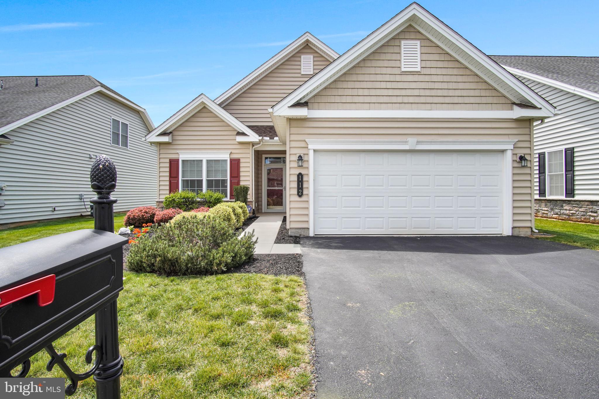 Welcome to this beautifully maintained detached Abigail model in the highly sought-after Traditions of America at Silver Spring active adult community. Offering nearly 1,300 square feet of comfortable one-level living, this 2-bedroom, 2-bath home combines style, convenience, and exceptional community amenities.
The gourmet kitchen features stainless steel appliances, gas cooking, granite countertops, and a center island perfect for entertaining or casual dining. The spacious great room showcases a cozy gas fireplace and sliding doors leading to a screened porch and patio overlooking additional green space behind the home for added privacy and relaxation.
The primary suite includes a large walk-in closet and a private bath, while the second bedroom and full bath provide comfortable accommodations for guests or a home office. An oversized garage and large utility room offer ample storage space.
Ideally located close to the clubhouse and community amenities, residents enjoy access to indoor and outdoor pools, fitness and exercise rooms, library, billiards room, pickleball and tennis courts, bocce, putting green, and miles of scenic walking paths. Experience low-maintenance living and resort-style amenities in one of the area’s premier 55+ communities!